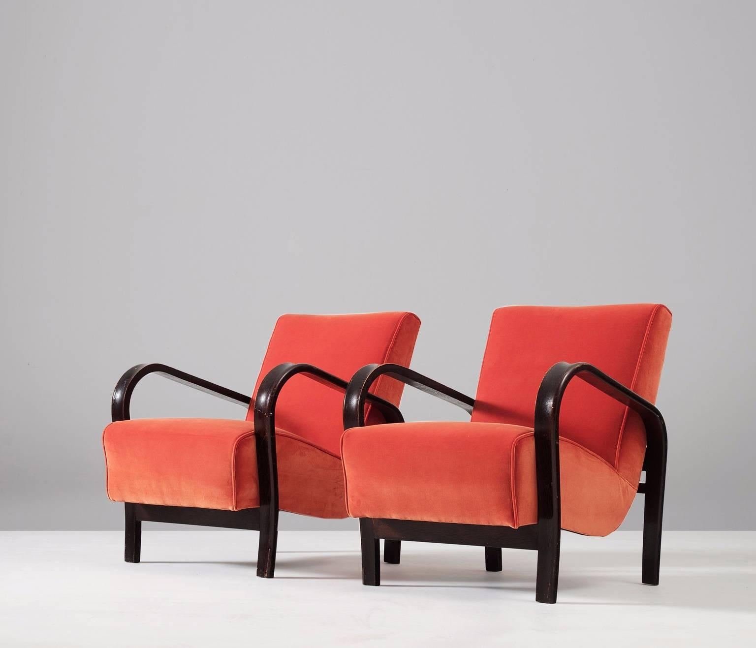 A pair of armchairs, in wood and fabric, by Jindrich Halabala, Czech Republic 1930s. 

Variant of the famous Halabala lounge chair. These armchairs have an elegant curved frame of bended wood. The seating is very comfortable due the springs. The