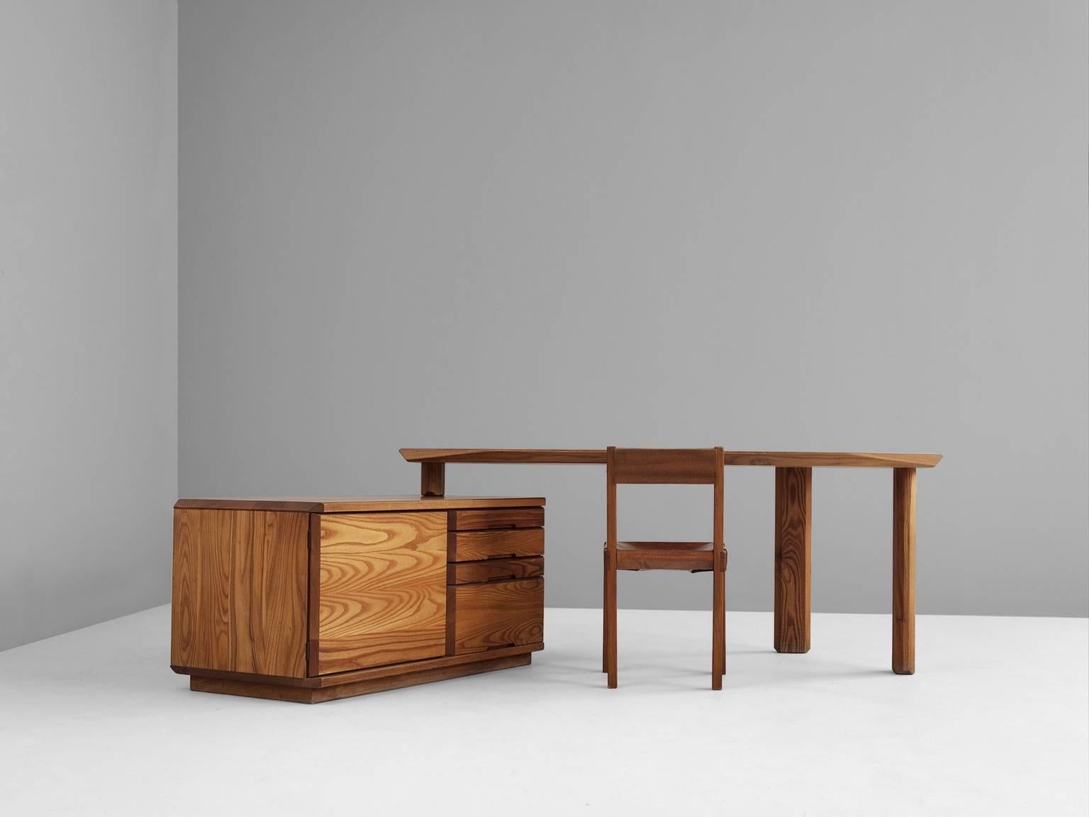 Desk, in solid elm by Pierre Chapo, France, 1960s.

Characteristic desk by French designer and carpenter Pierre Chapo. Eye-catching detail is the beautiful and expressive grain of the elmwood, visible on the entire item. Stunning polygonal table