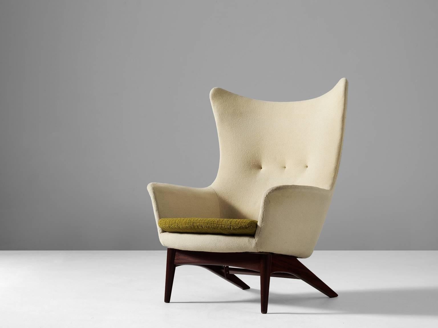 Wingback chair, by H.W. Klein for Bramin, Denmark, 1950s.

Sculptural lounge chair by Henry Walter Klein. This wingback chair is a great example of Scandinavian design and comfort. Beautiful organic formed seating, with solid wooden frame. The