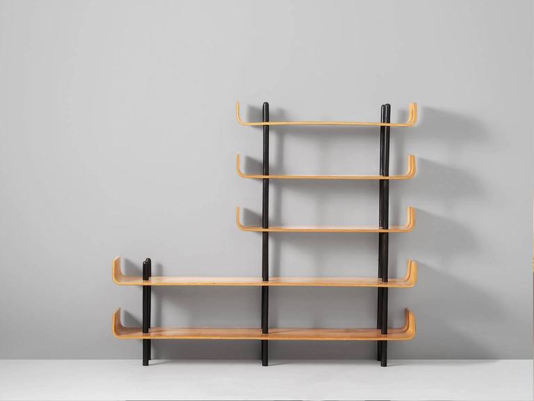 Bookcase, in plywood, by Willem Lutjens for Den Boer Gouda, the Netherlands 1953.

Bookcase with five shelves in maple plywood. Each shelve has curved ends, characteristic for this design by Lutjens. Hold together by six black coated stands, who