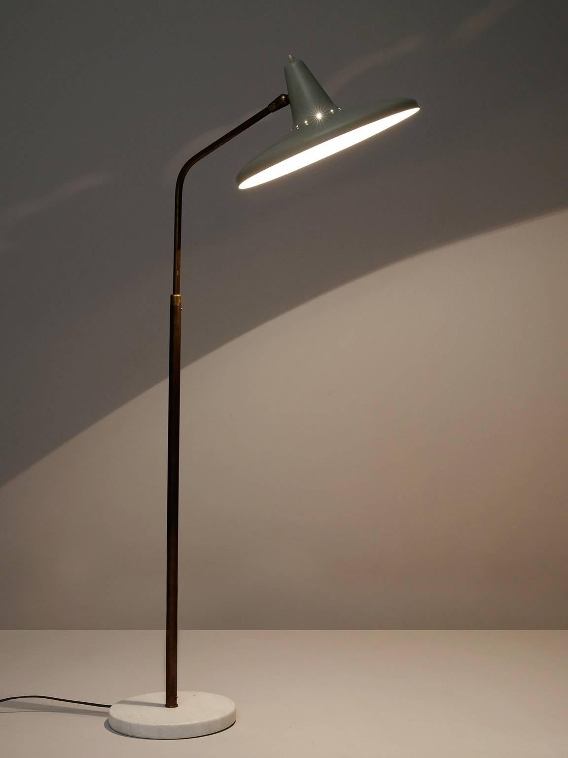 Floor lamp, in brass, marble and metal, by Giuseppe Ostuni for O-Luce, Italy 1955.

Adjustable floor lamp with telescopic mechanism. This marble based floor lamp is another great example of the quality and ingenuity of the Italian lighting