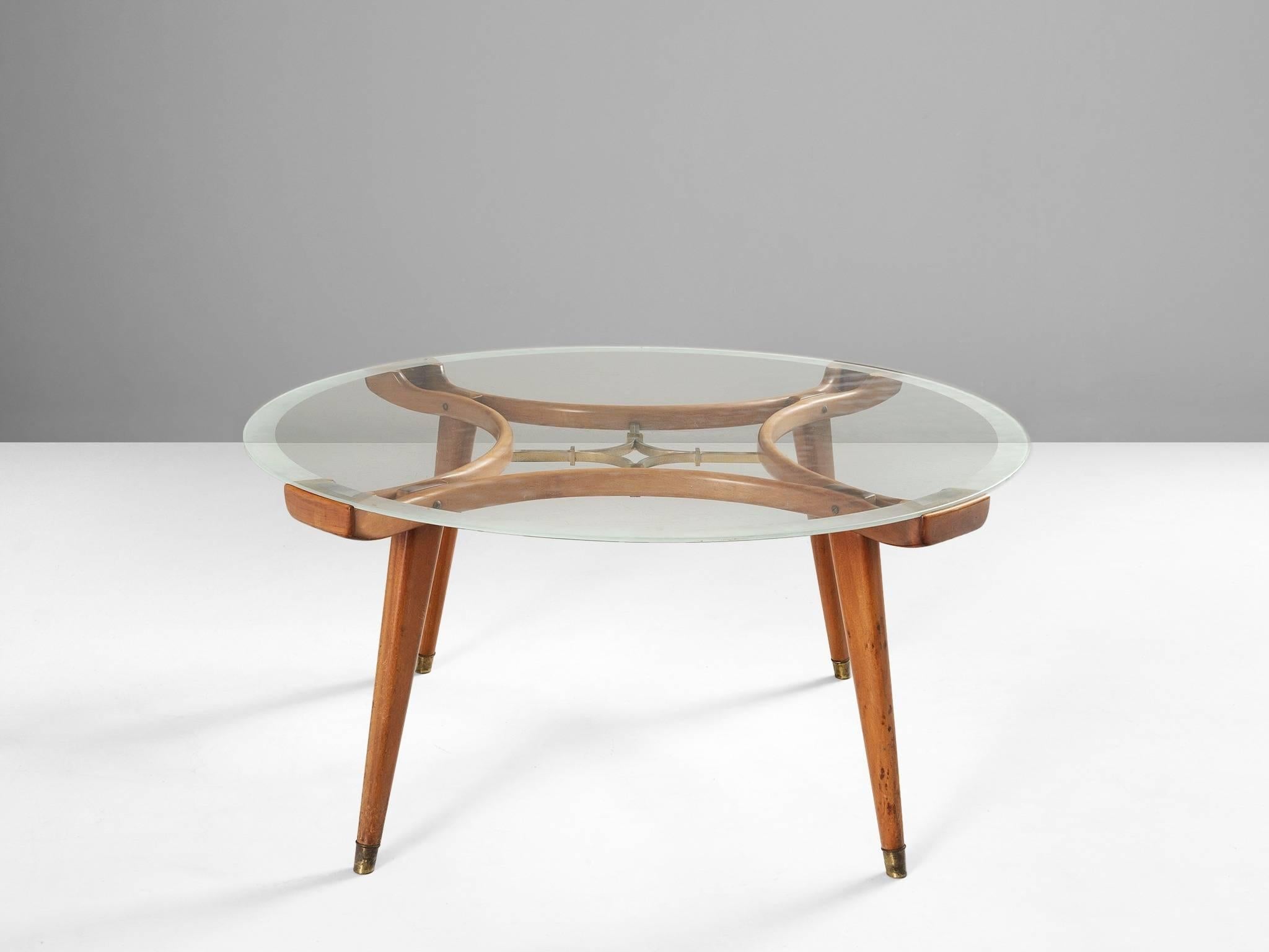 Coffee table, in glass, brass, walnut and mahogany, by William Watting for Fristho Franeker, the Netherlands 1955. 

Wonderful designed coffee table in the style of Gio Ponti and Giordano Chiesa. The table has been very well made with high-quality