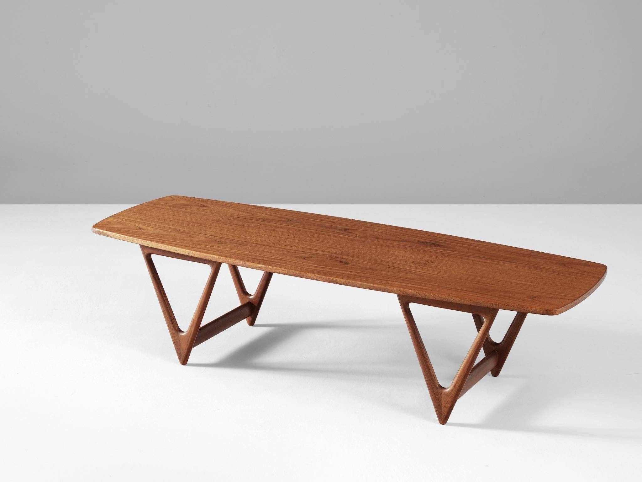 Coffee table, in teak, by Kurt Østervig for Jason Mobler, Denmark 1960s.

Large coffee table in teak. The rectangular top is slightly boat-shaped. The four legs are triangles, with cross-connections. The legs are nicely rounded on the edges. This