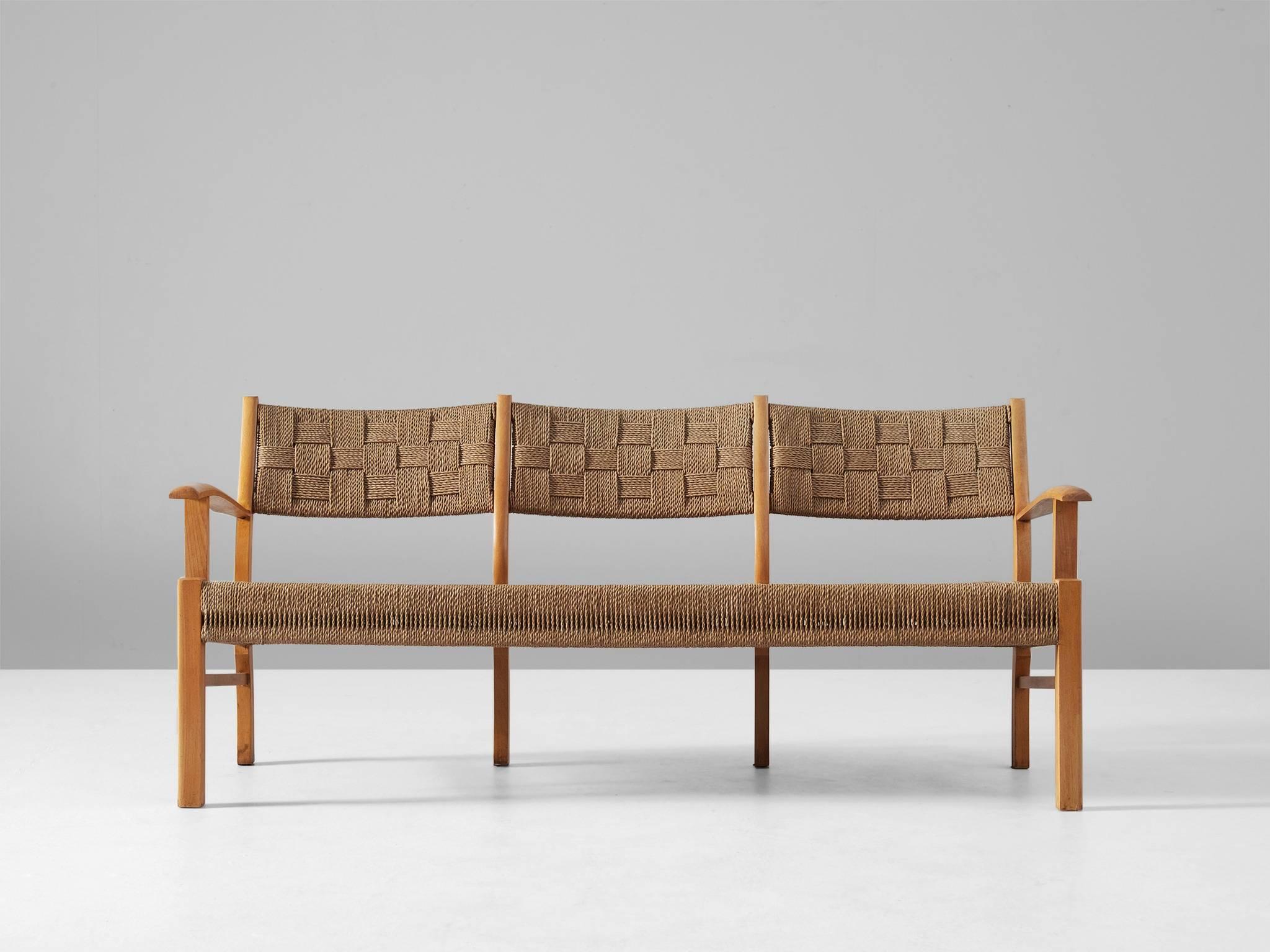 Three-seat sofa, in beechwood and seagrass, Denmark, 1950s.

Elegant wooden sofa with back and seating of braided seagrass rope. The frame of this sofa is made of solid beech and has a very nice and warm blond color. The back-legs and armrests