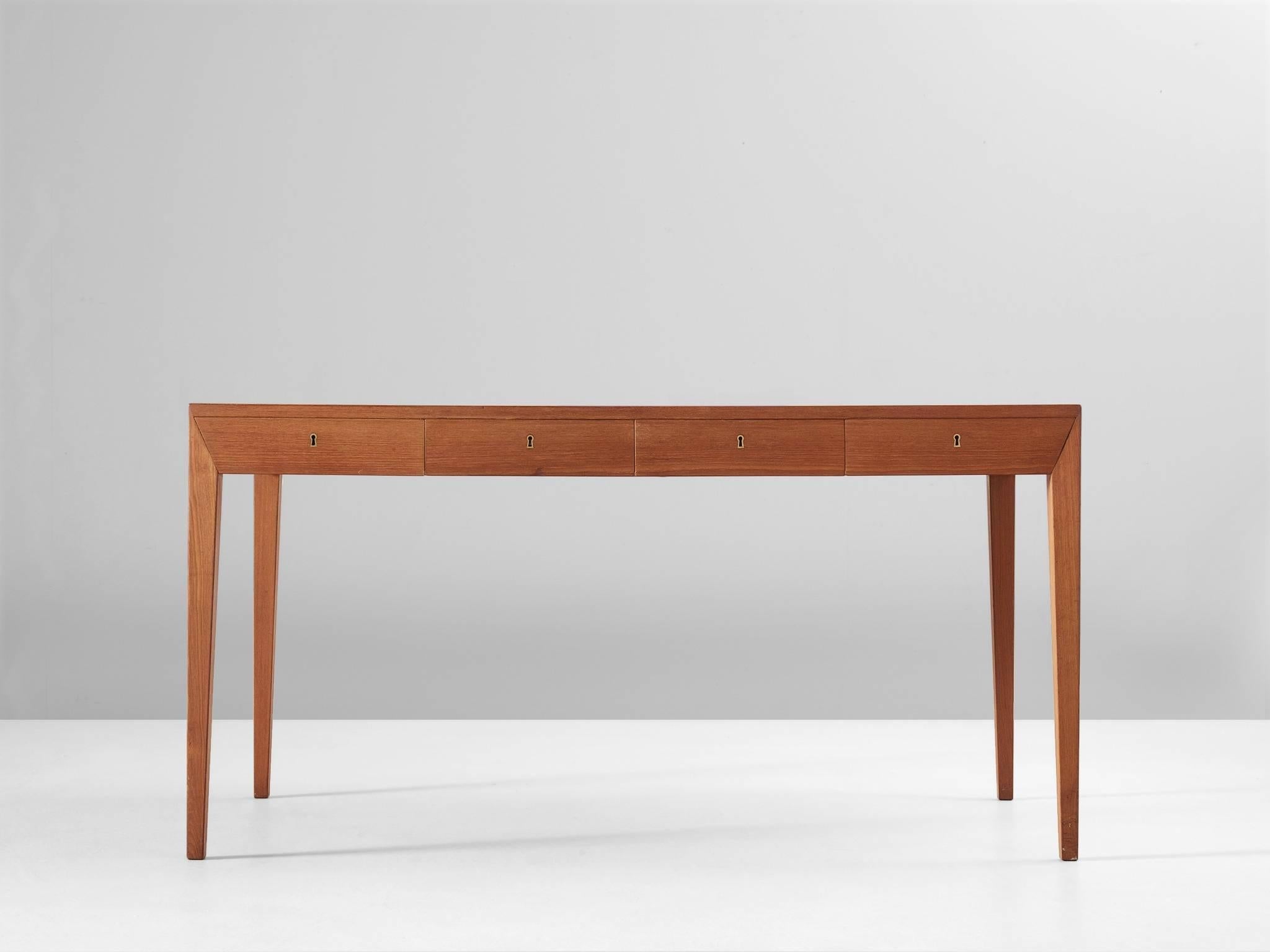 Desk, in teak, by Severin Hansen Jr. for Haslev, Denmark, 1960s.

Highly elegant and simplified desk with four drawers. This writing table is executed in teak. Exceptional detail is the back, which is also in teak, what makes it not only an