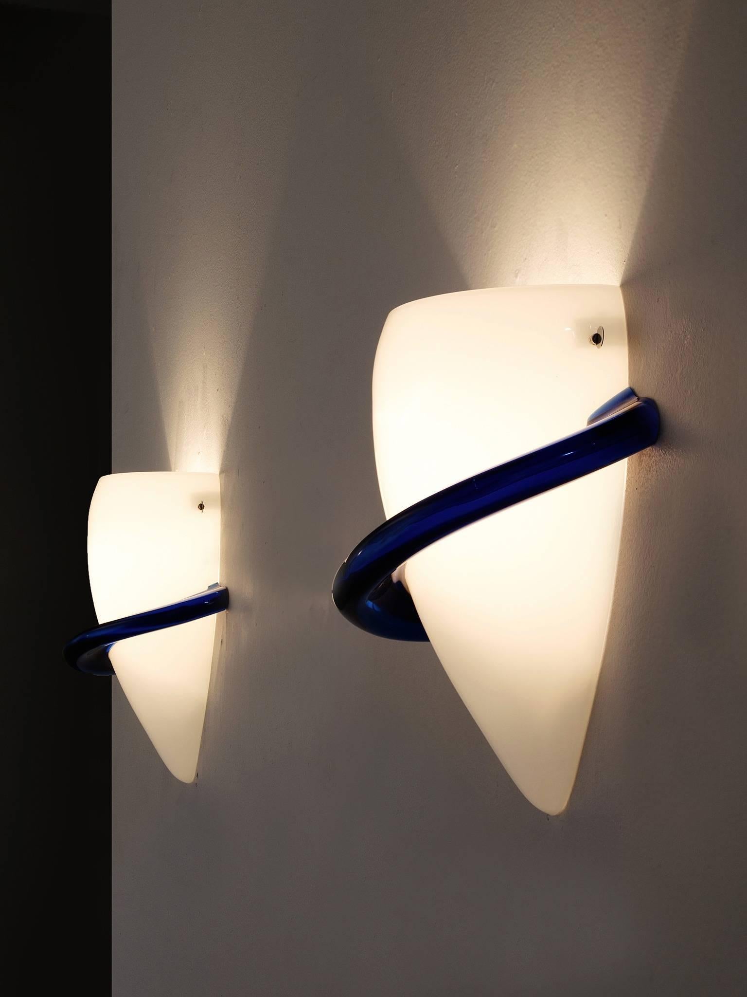 Pair of sconces, in glass, by Tina Marie Aufiero for Venini, Italy 1985.

Elegant pair of wall-lights in white and blue colored glass by the Italian manufacturer Venini. These lights show soft and curved forms, which gives them their elegance. The