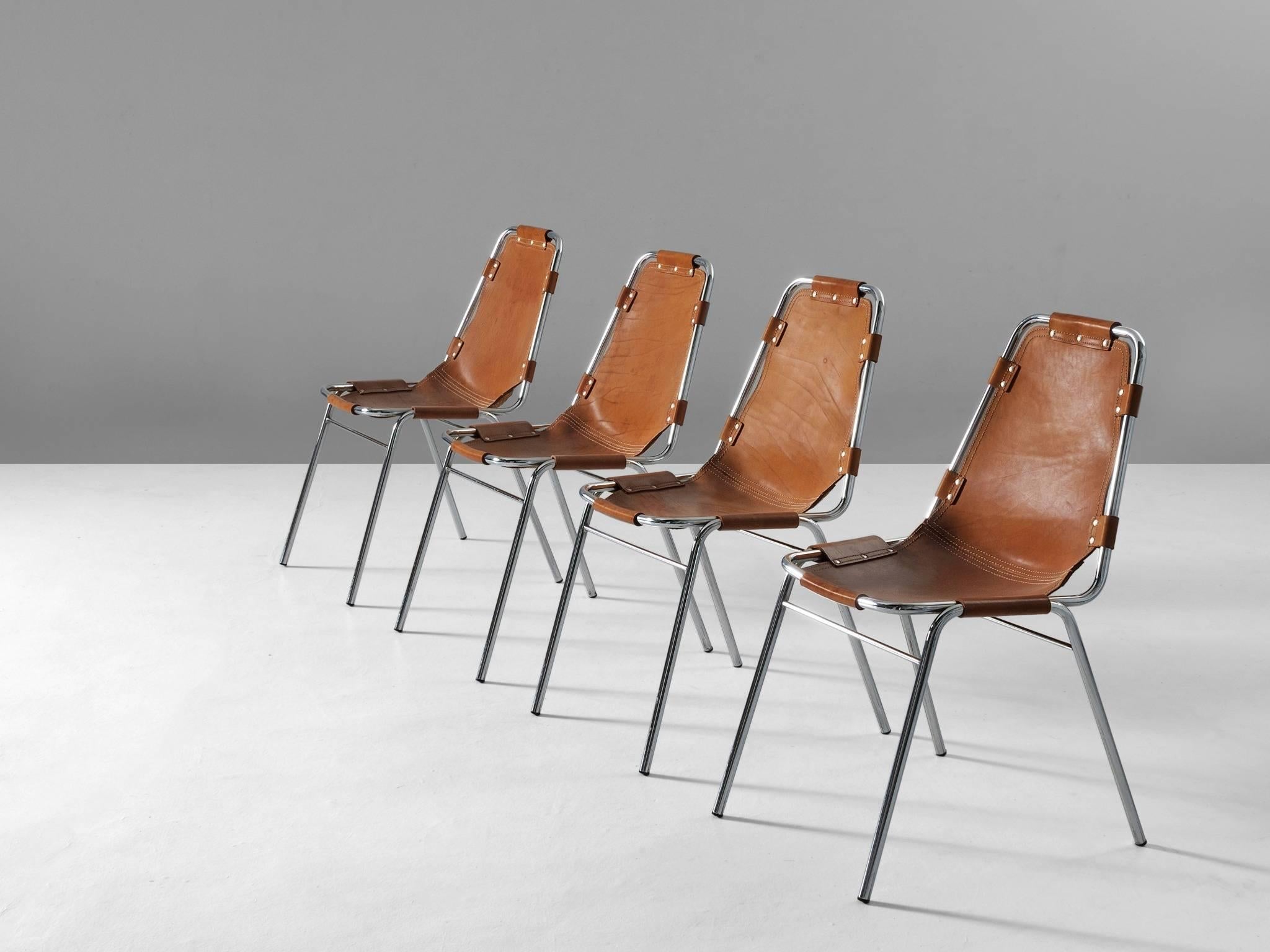 Set of four chairs, in steel and leather, France, circa 1970s.

Set of four chairs of the famous model 'Les Arcs' . The simplistic design consist of a tubular steel frame with a seating of thick cognac saddle leather. The natural leather makes a