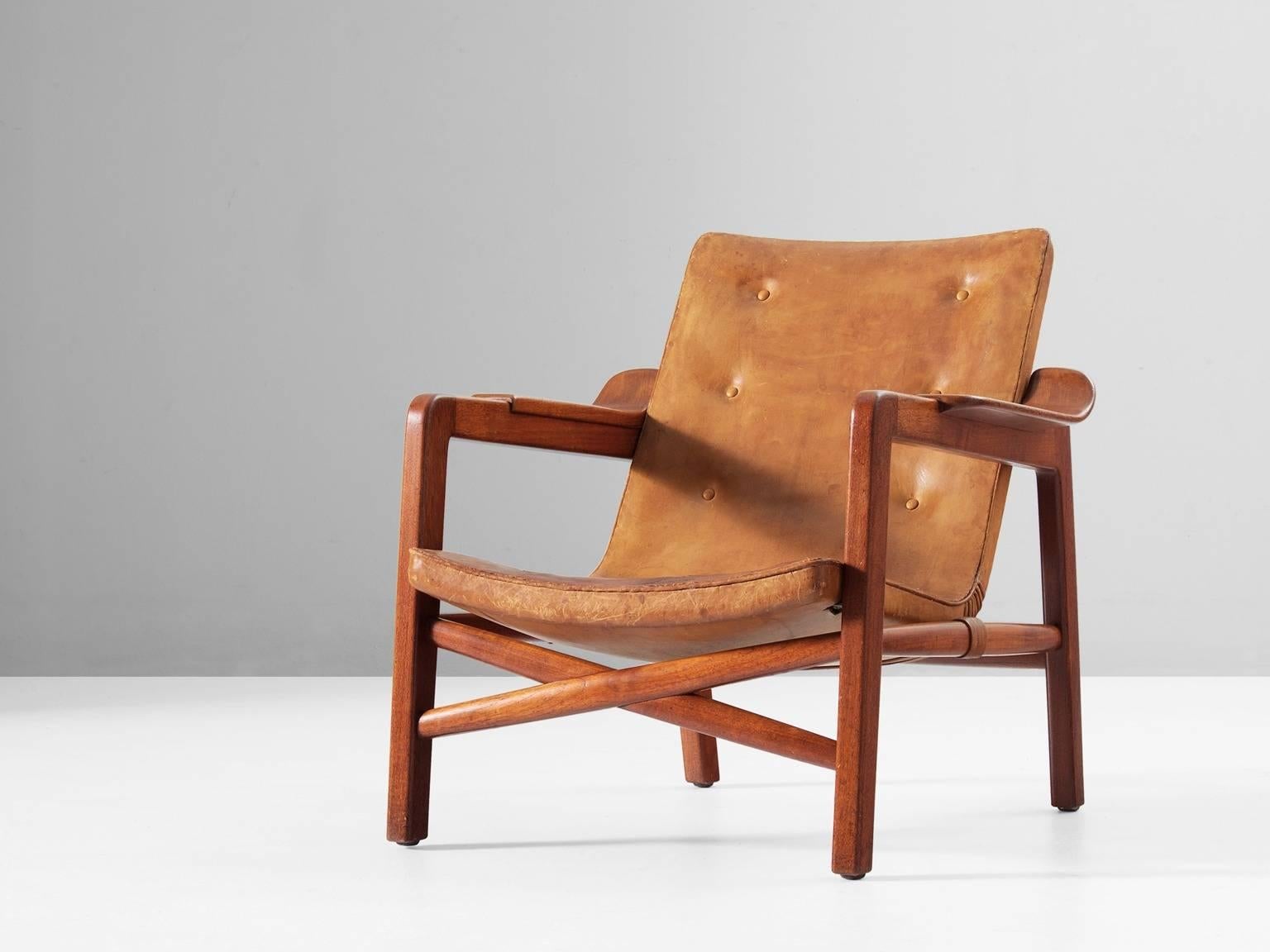 'Fireplace' chair, in teak and leather, by Tove & Edvard Kindt-Larsen for Gustav Bertelsen, Denmark, 1939..

This lounge chair was specially designed to sit in front of a fireplace. When it was first exhibited, this model was mentioned as a