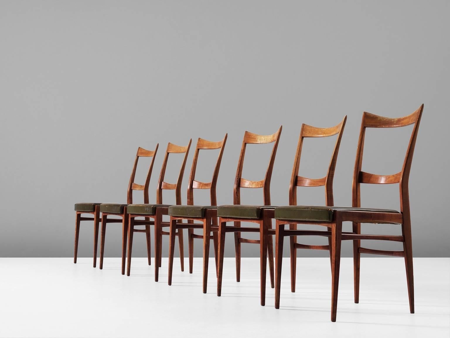 Set of six dining chairs, in walnut and leather, Italy, 1940s. 

Real slim designed Italian dining chairs in it's original green leather upholstery. Very well detailed wood with very smart shapes and edges. The frame of these chairs is very