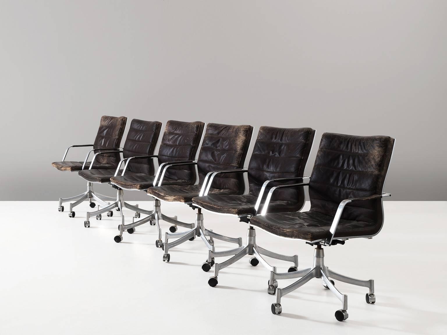 Set of six office chairs model BO-854, in leather and metal, by Jørgen Lund & Ole Larsen for Bo-Ex, Denmark, 1960s.

Modern office chairs in dark brown leather and brushed metal frame. These swivel chairs show great elegance. The five-legged base