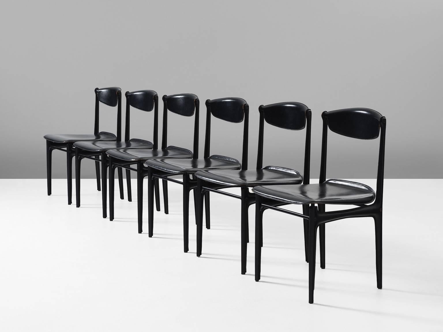 Set of six chairs in leather and metal, Italy, 1960s.

Highly elegant set of six dining chairs. These chairs consist of a metal frame wrapped in black leather. The frame is modest and frail. With the leather 'upholstery', the tight frame gets more
