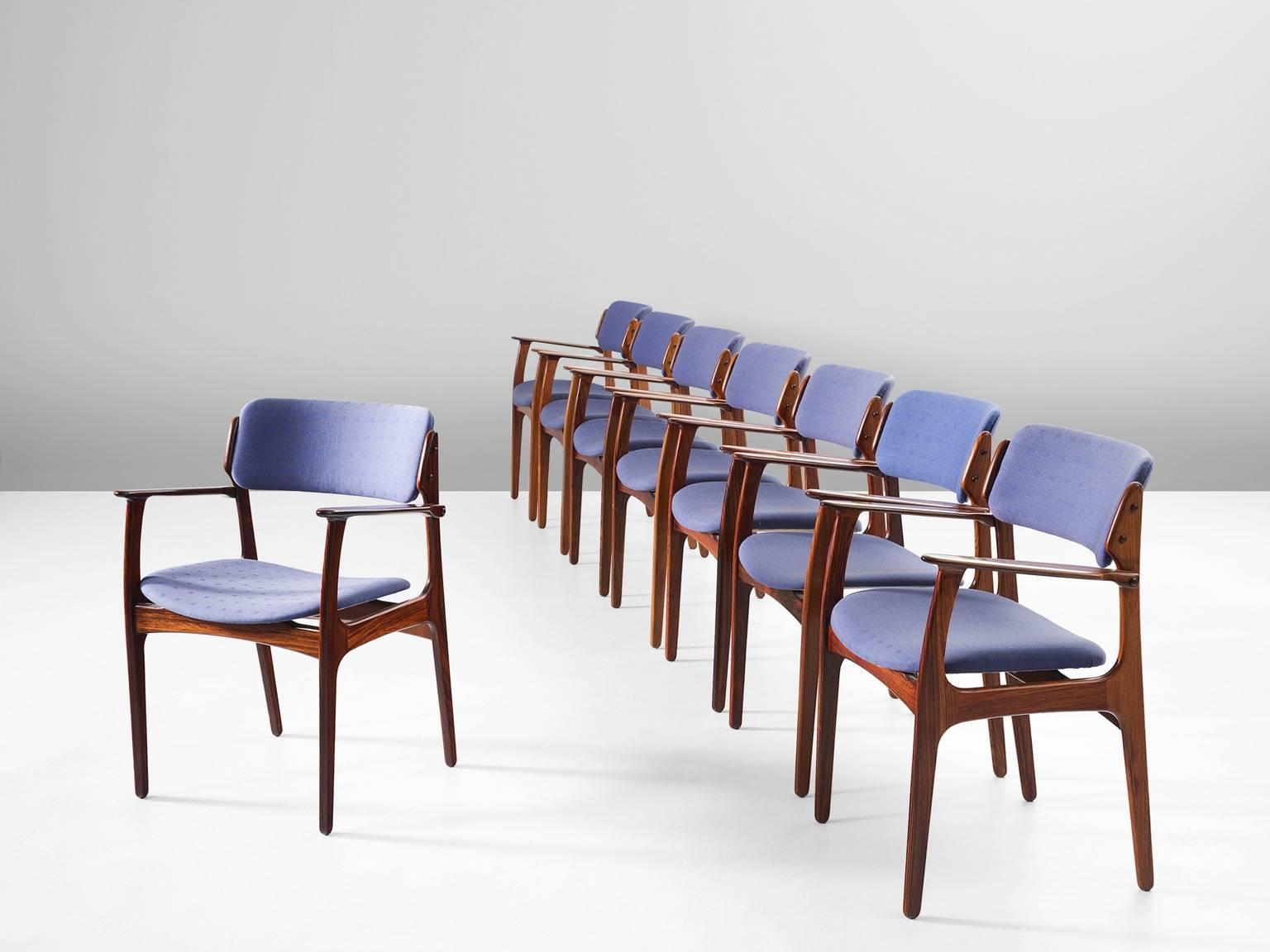 Set of eight dining chairs model 50, in rosewood and fabric, by Erik Buck, Denmark, 1957.

These chairs show elegant lines, and stunning wood connections. A solid construction with an almost floating seat and backrest. Highly comfortable due the
