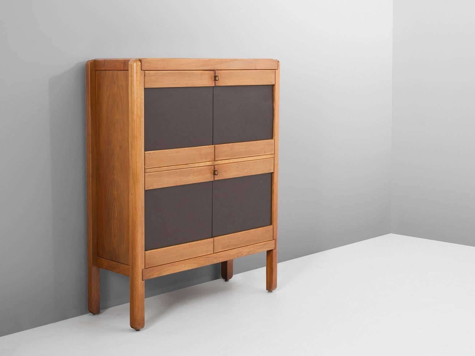 Cabinet in walnut, leather and brass, for Van den Berghe Pouvers PVBA, Belgium, 1960.

Highboard in walnut veneer with dark brown leather doors. Beautiful rounded edges and brass details. The leather front makes a nice contrast to the natural