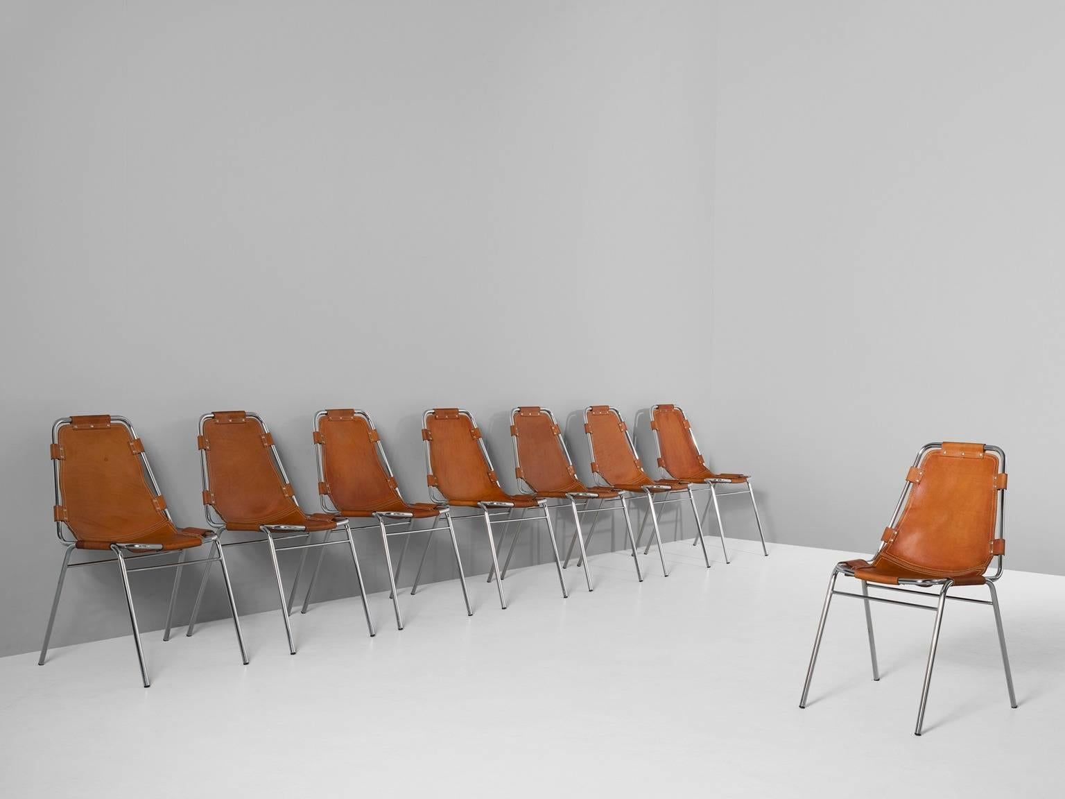 Set of eight chairs, in steel and leather,  Italy, circa 1970s.

Set of eight chairs of the famous model 'Les Arcs'. The simplistic design consist of a tubular steel frame with a seating of thick cognac saddle leather. The natural leather makes a
