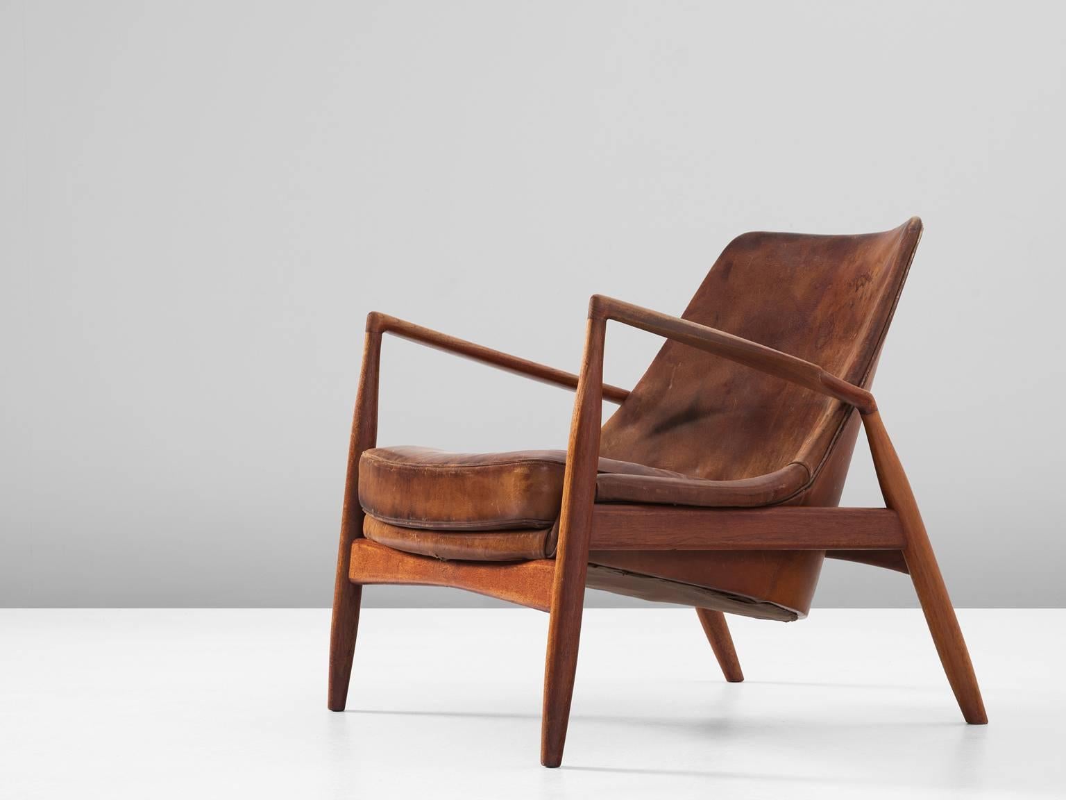 Lounge chair 'Seal' model 503-799, in teak and leather, by Ib Kofod-Larsen for OPE, Sweden, 1956. 

Beautiful and iconic Seal lounge chair. The well crafted frame of this chair is made in solid teak. It shows very nice details and wood joint, and