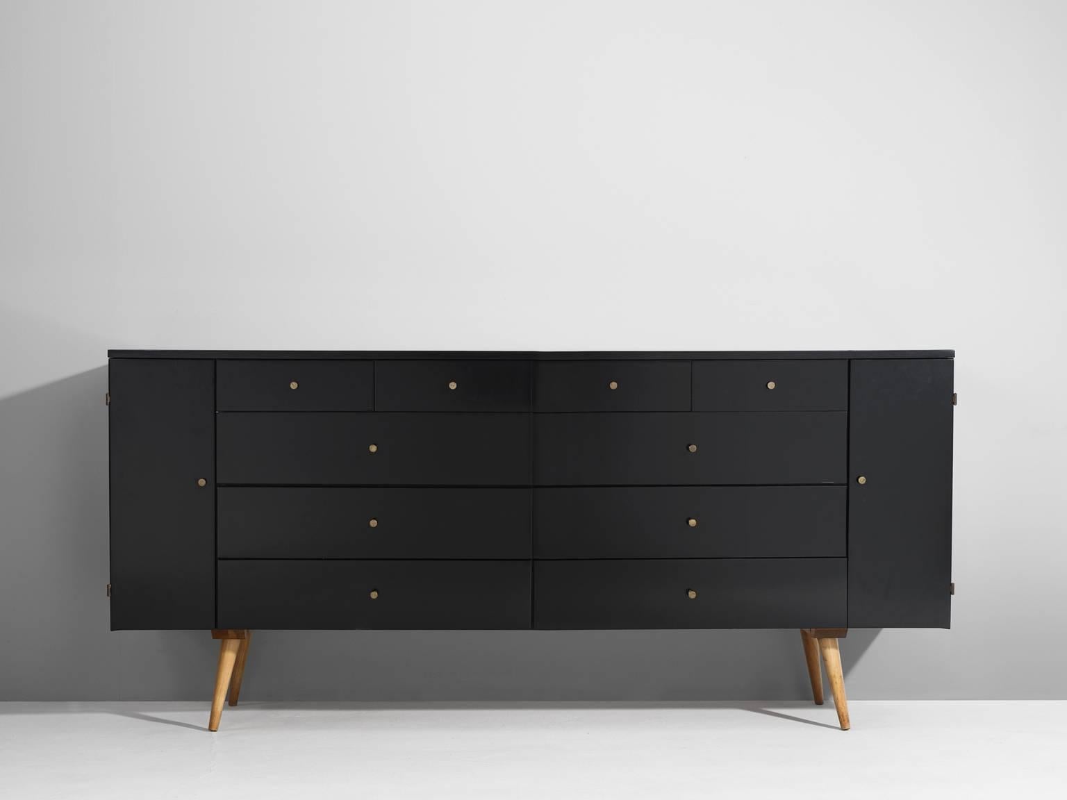 Dresser, in maple and brass, by Paul Mc Cobb for Planner Group, United States, 1960s. 

Small cabinet by Paul McCobb. This black coated cabinet shows great details and elegant brass handles. The dressers consist of two lines of drawers,