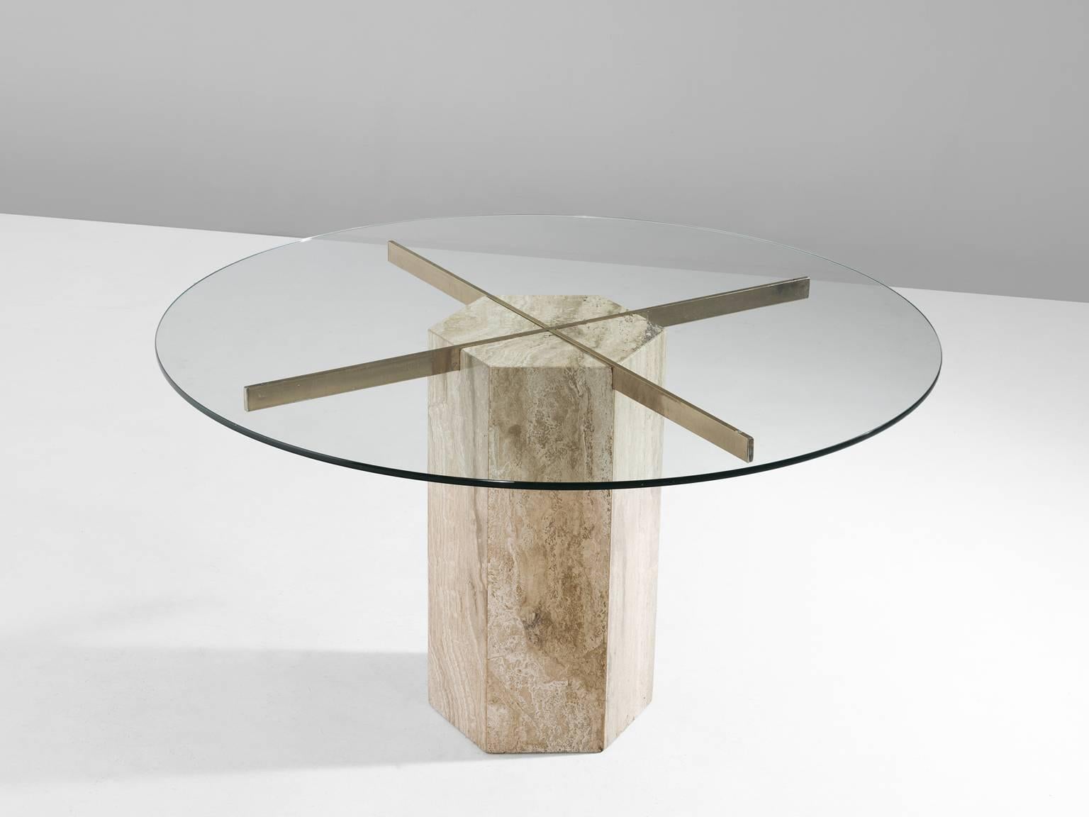 Dining table, in travertine, glass and brass, Italy, 1970s.

Luxurious Italian dining table. The table has a travertine base with a brass cross, which holds the round clear glass top. Due the clear glass, the brass and travertine are beautiful