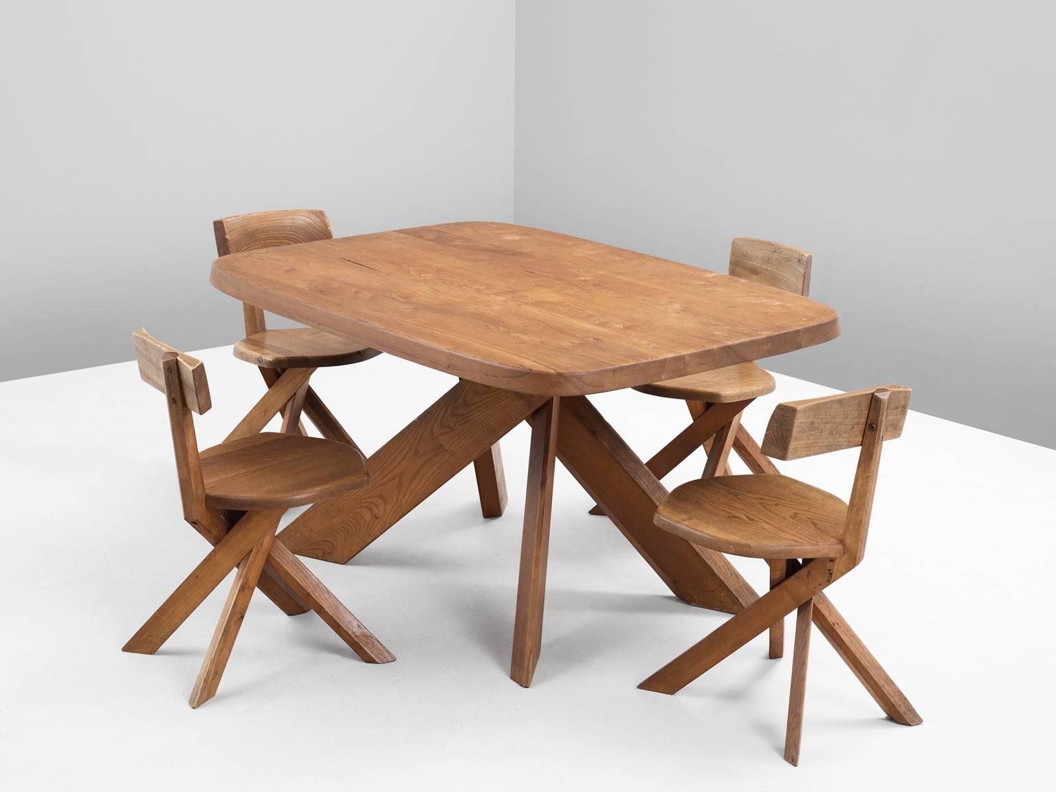 Dining table T35B and four chairs S34, in elm by Pierre Chapo, France, 1960s.

Small dining table and four chairs in solid elm by master woodworker Pierre Chapo. The basic design and construction, as well as the use of solid pine wood