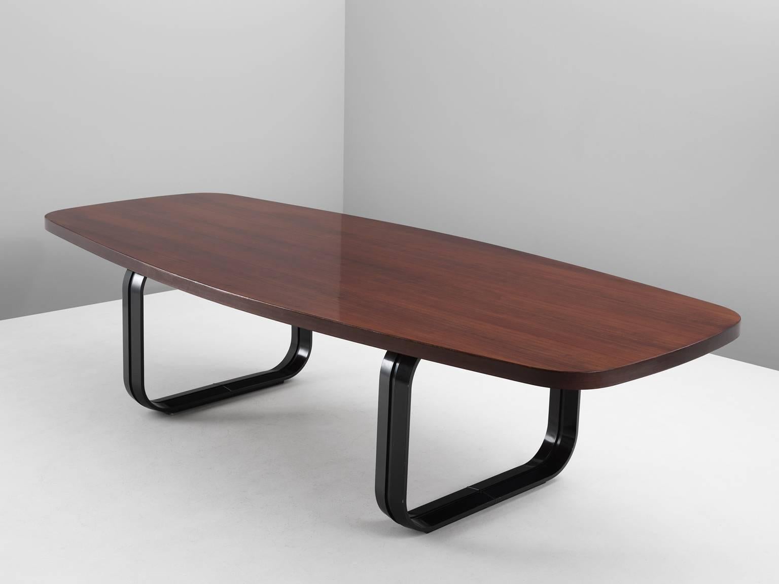 Dining table in mahogany and metal, Italy, 1960s.

Large conference table with boat shaped top. The top shows the beautiful grain of the mahogany wood. The base consist of two square legs made out of bended metal. These modern metal legs make a