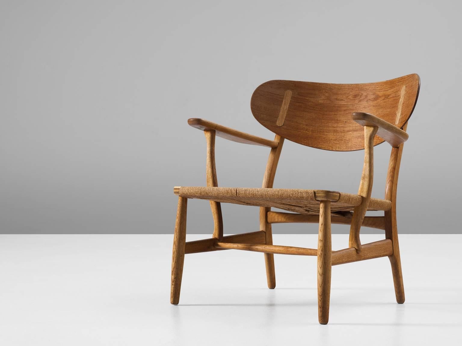 Armchair model CH22 in oak and paper cord by Hans J. Wegner for Carl Hansen & Søn, Denmark, 1950.

One of Wegners early masterpieces for Carl Hansen. The chair bears the first number of a highly interesting collection that was realized during the