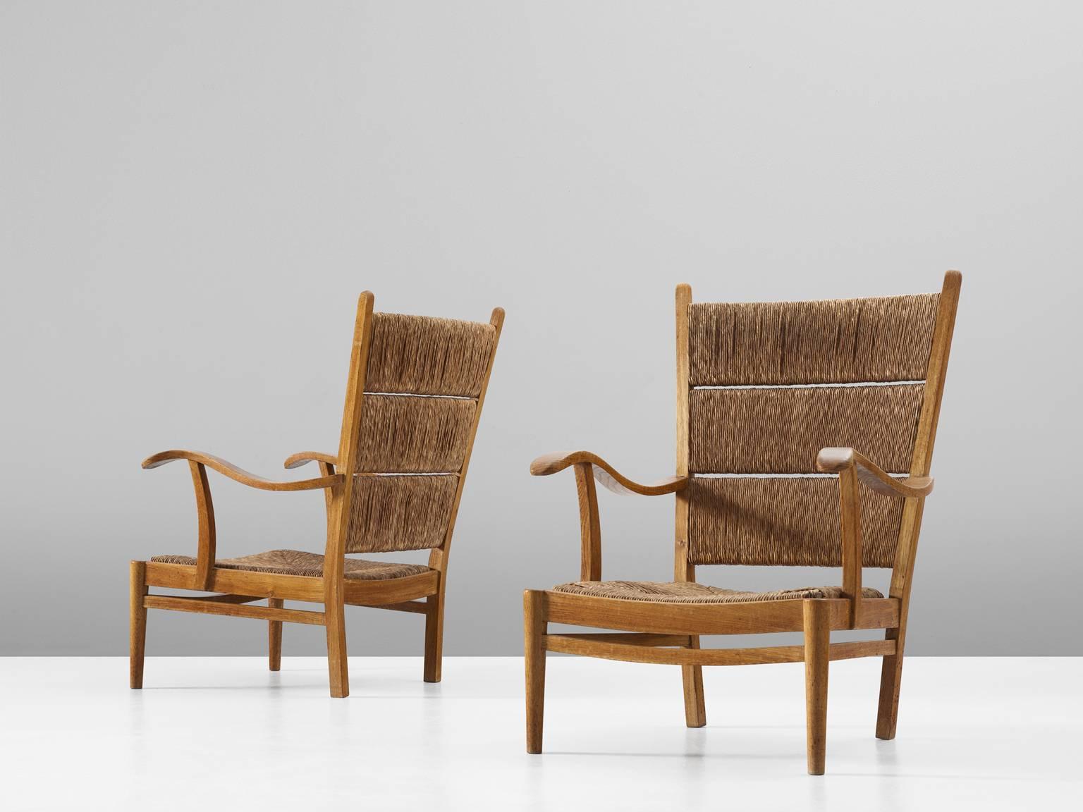 Pair of high back armchairs, in oak and paper-cord, by Bas Van Pelt for My Home, the Netherlands, 1940s.

Elegant pair of lounge chairs by Dutch designer Bas Van Pelt. These chairs have a royal and wide appearance, yet executed in natural