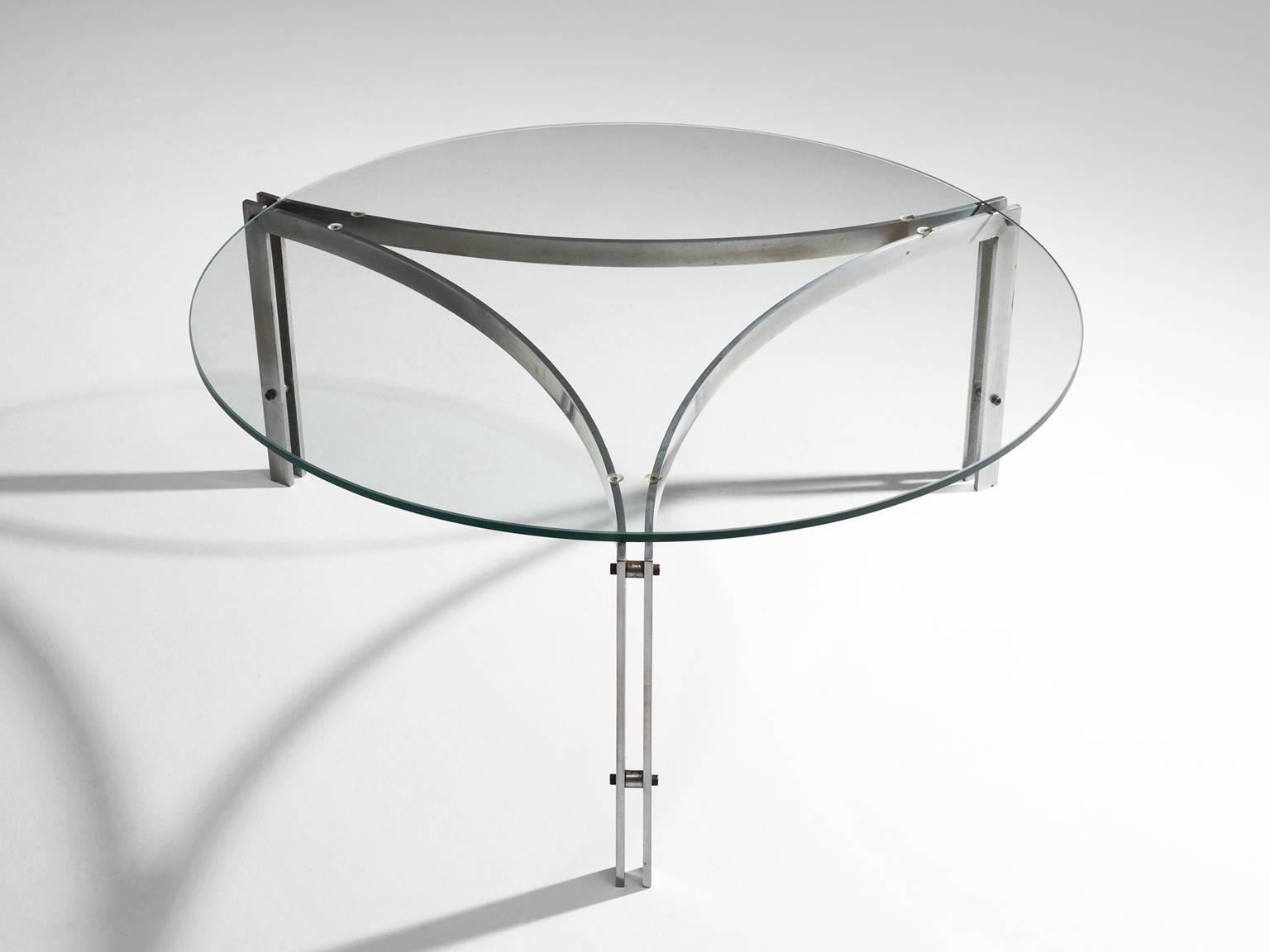 Round coffee table in glass and stainless steel, Denmark, 1970s. 

Designed in the style of Fabricius and Kastholm. This minimalistic table has a rounded triangular frame with a clear, sincere design. The three similar frame elements are connected