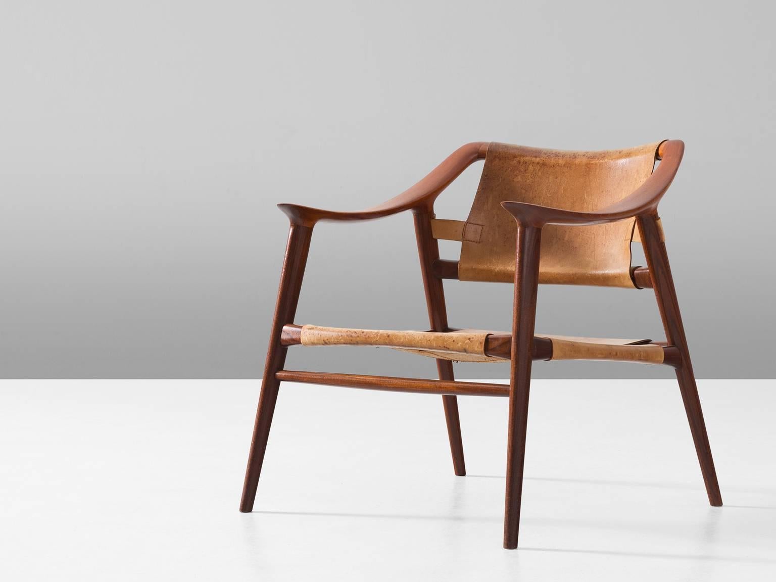 Armchair model 56/2 'Bambi', in teak and leather, by Rolf Rastad & Adolf Relling for Gustav Bahus, Norway, circa 1954. 

Excellent example of the 'Bambi' chair of Rolf Rastad and Adolf Reling. This edition consist of a teak frame and cognac