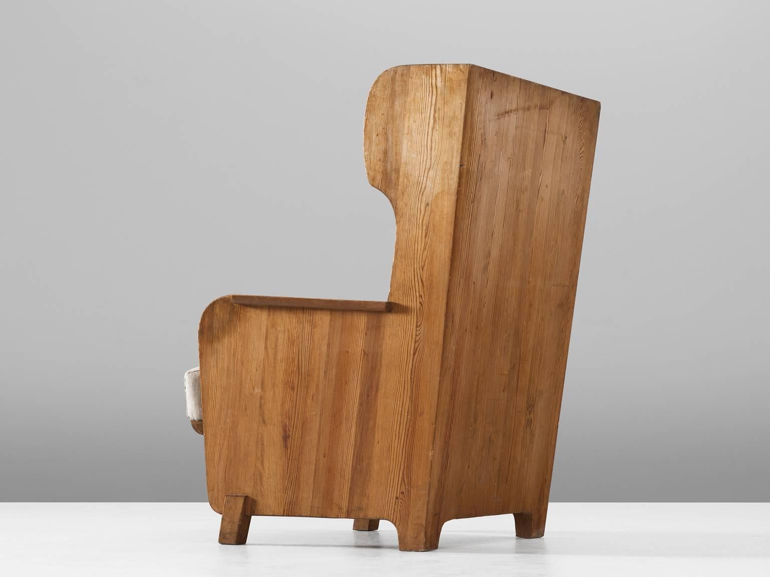 wooden high back armchair