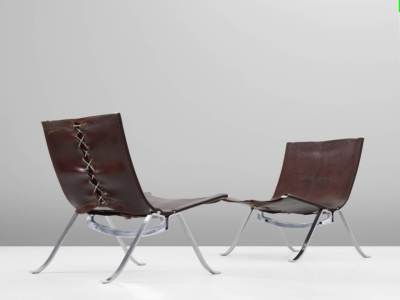 Easy chairs, in brushed metal and leather, by Preben Fabricius for Arnold Exclusiv, Denmark, 1971. 

A pair of lounge chairs by Preben Fabricius. Rare to find as a set of two with original leather upholstery. The very well formed brushed steel