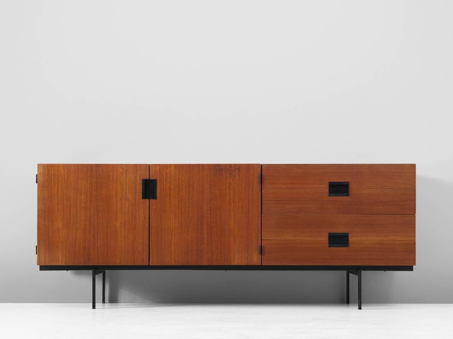 Sideboard model DU04, in teak and metal by Cees Braakman for UMS Pastoe, The Netherlands, 1958. 

Elegant and modest teak sideboard by Cees Braakman for UMS Pastoe. This sideboard consist of a small metal base, which create some lightness to the