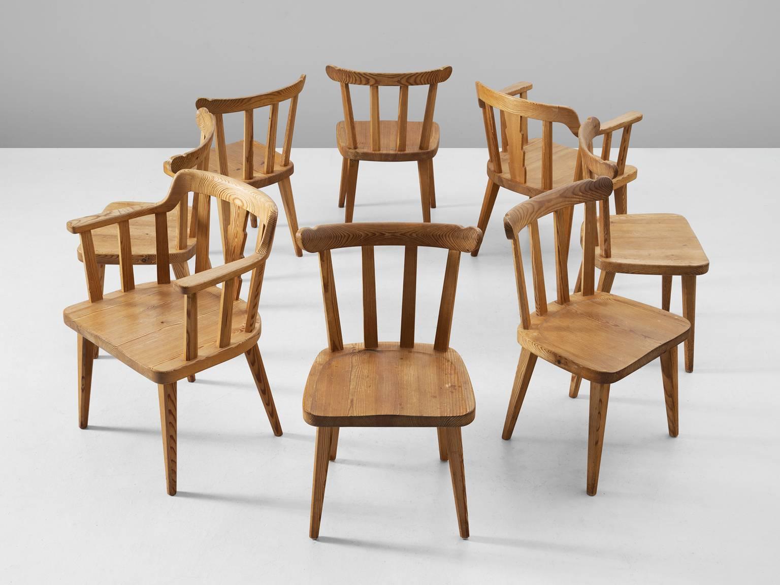 Set of eight chairs Ekerö, in pine, Sweden, 1930s.

Elegant set of six dining chairs and two armchairs. Executed in northern European pinewood with stunning patina. The design is simplistic; four tapered legs, solid seating and spindle or slat