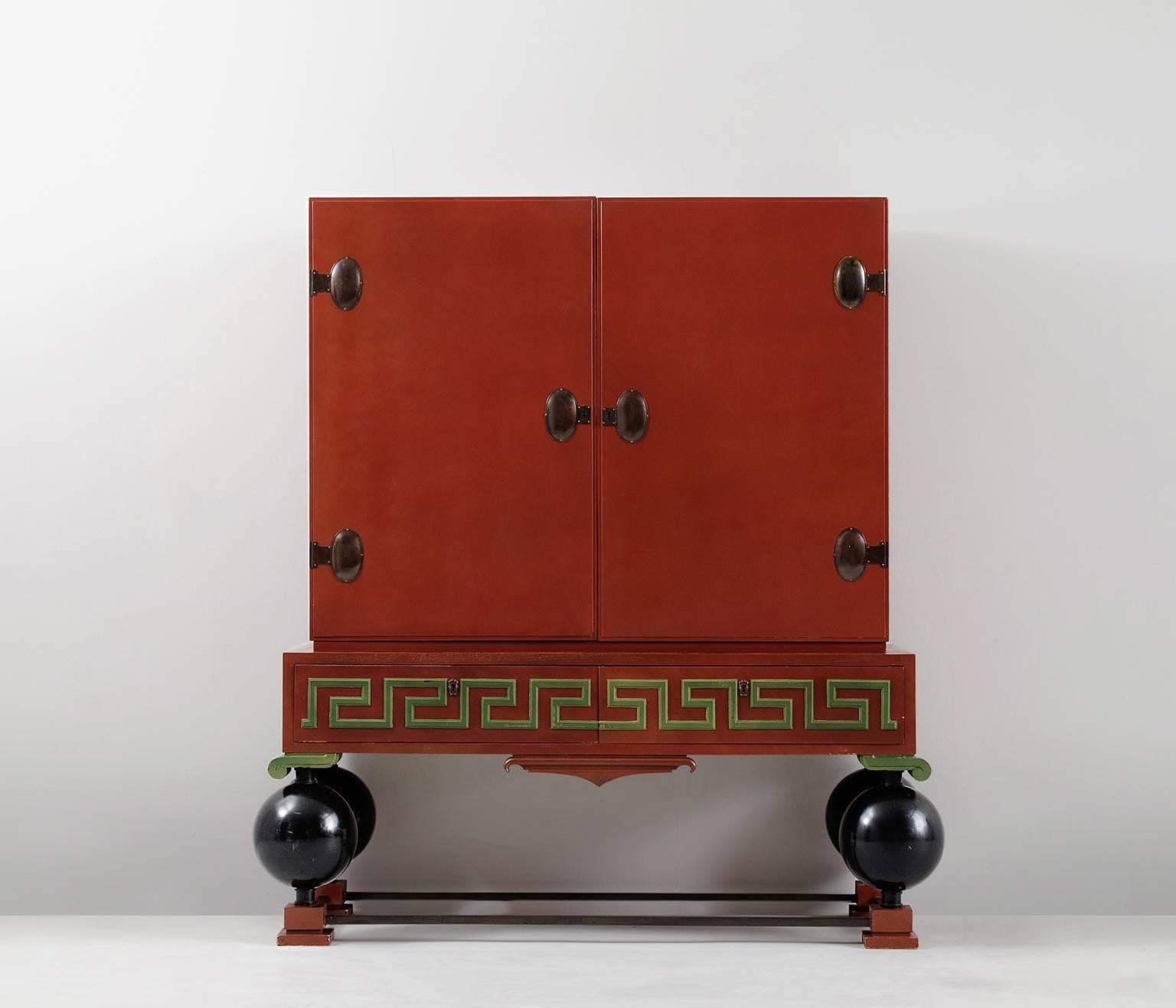 Cabinet, in wood and metal, by Paul Boberg, Sweden, 1930s. 

Large decorative cabinet, in red and green. At the front this highboard is divided over two large doors and two drawers. All compartments can be locked. 

Once opened, a