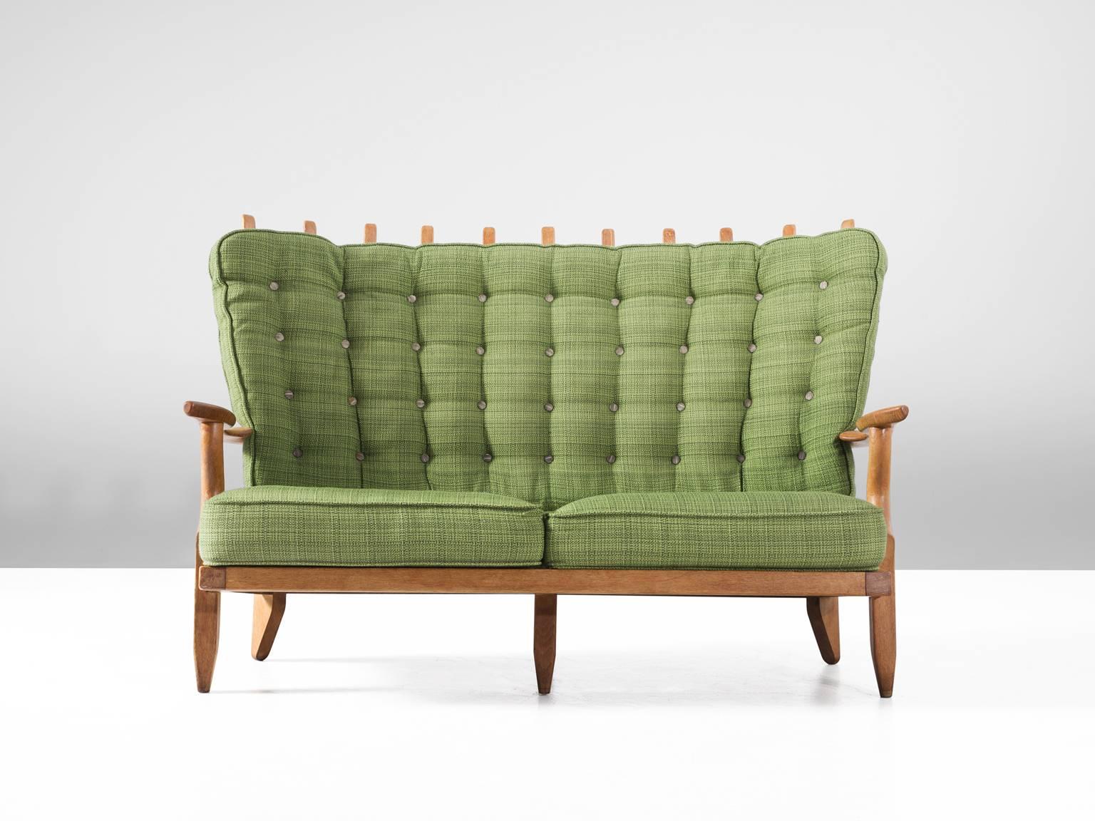 Sofa, in oak and fabric, by Guillerme et Chambron, France 1960. 

Extraordinary sofa by de French designers Guillerme and Chambron of the 'Votre Maison' collection. With a trademark high back, in solid oak with the typical characteristic