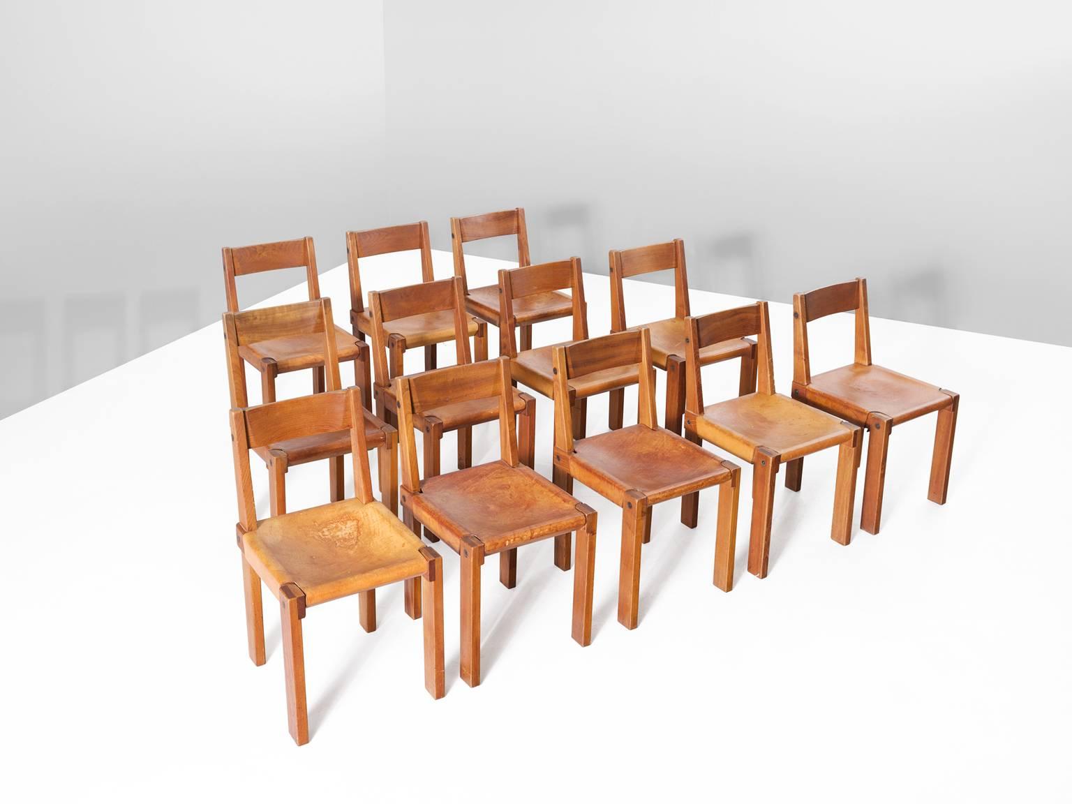 Set of 12 chairs model S24, in elm and leather by Pierre Chapo, France, 1960s.

Large set of 12 dining chairs by French designer and carpenter Pierre Chapo. The chairs consist of solid elmwood with a saddle leather seat. The design of the chairs