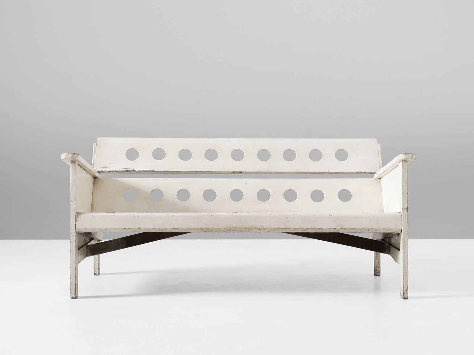 Sofa, in wood, by Jan Cocks, the Netherlands second half of the 20th century.

Interesting bench in white lacquered wood by Dutch artist Jan Cocks. This garden bench shows a basic design. Due the sloping lines and circles in the back the design