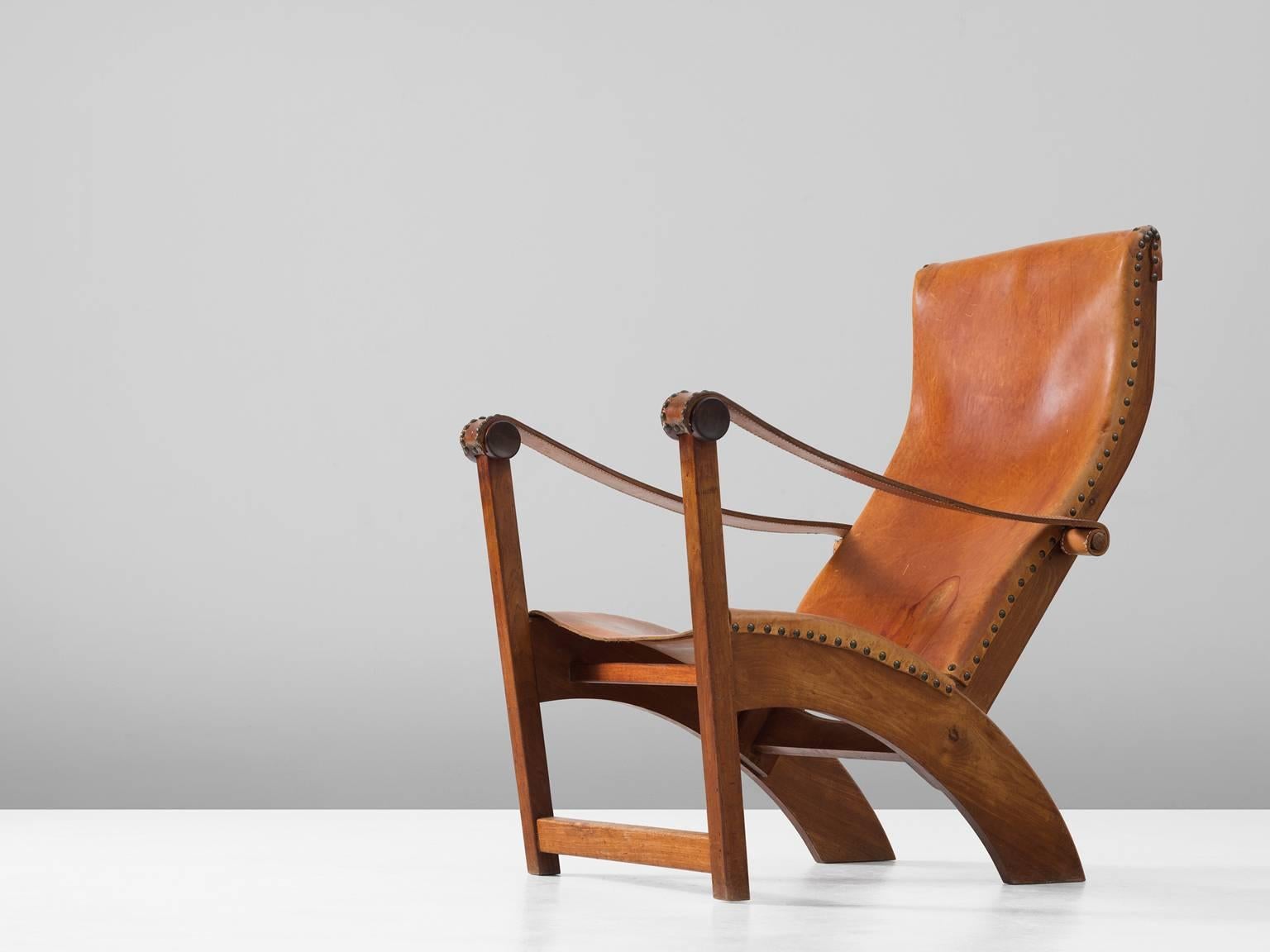 Lounge chair model 'Københavnerstolen', in mahogany and leather, by Mogens Voltelen for Niels Vodder, Denmark, 1936. 

Stunning Copenhagen chair by Mogens Voltelen. This chair shows beautiful lines as seen on the arched legs on the back of the