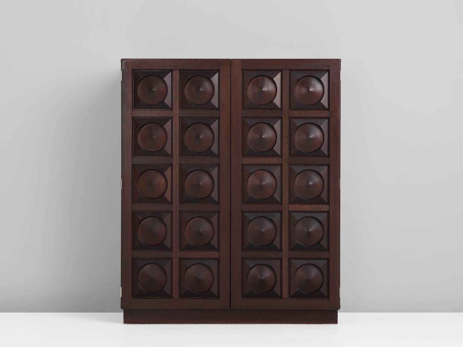 Bar cabinet, in mahogany, plastic and wood, Europe 1970s.

Brutalist highboard in dark brown stained mahogany. This cabinet shows excellent woodwork on the two door panels. A combination of squares and circles is combined into a graphical and
