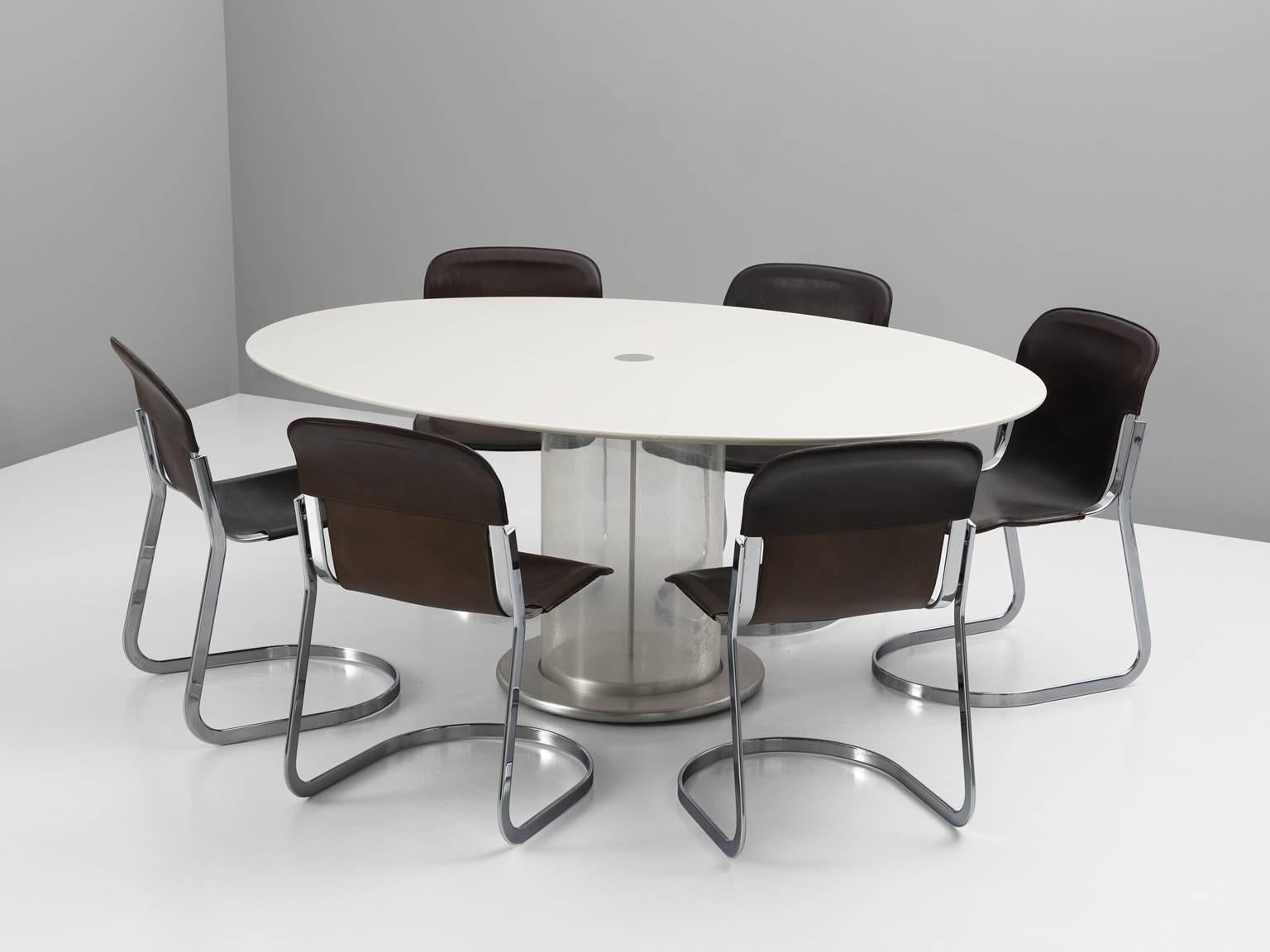 Dining set, consisting of one table, 'Elisse', in Lucite, metal and wood, by Claudio Salocchi for Sormani, Italy 1970s. 
And six-chair, in chrome and leather, by Cidue, Italy 1970s. 

Modern dining room set, consisting of a large oval dining