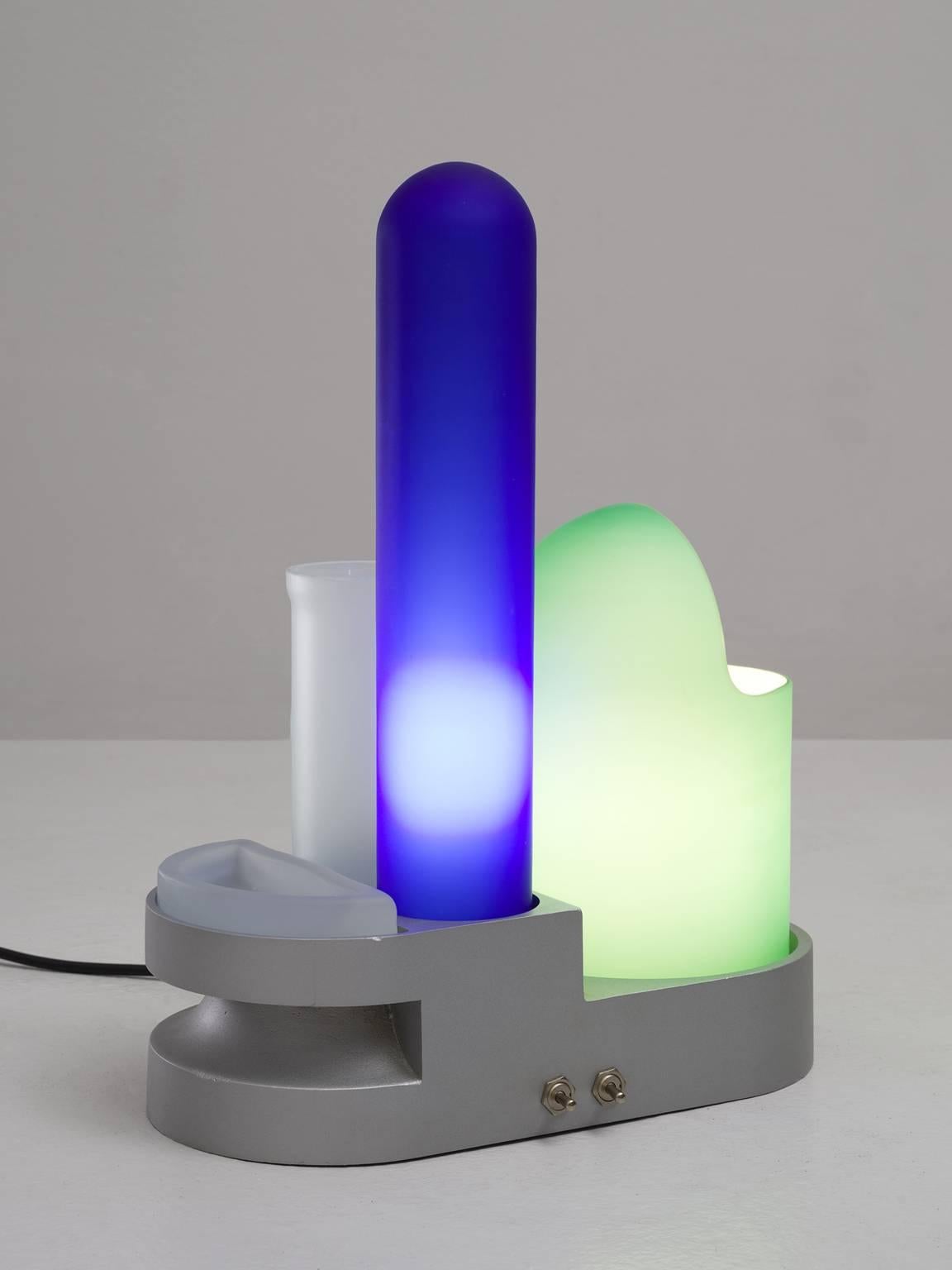 'Rimorchiatore' table lamp, in aluminum and glass, by Gae Aulenti for Candle or Fontana Arte, Italy, 1967.

Colorful and frivolous table light. This 'tug-boat' is made of a cast aluminum base with several glass shades. Each colored glass item has