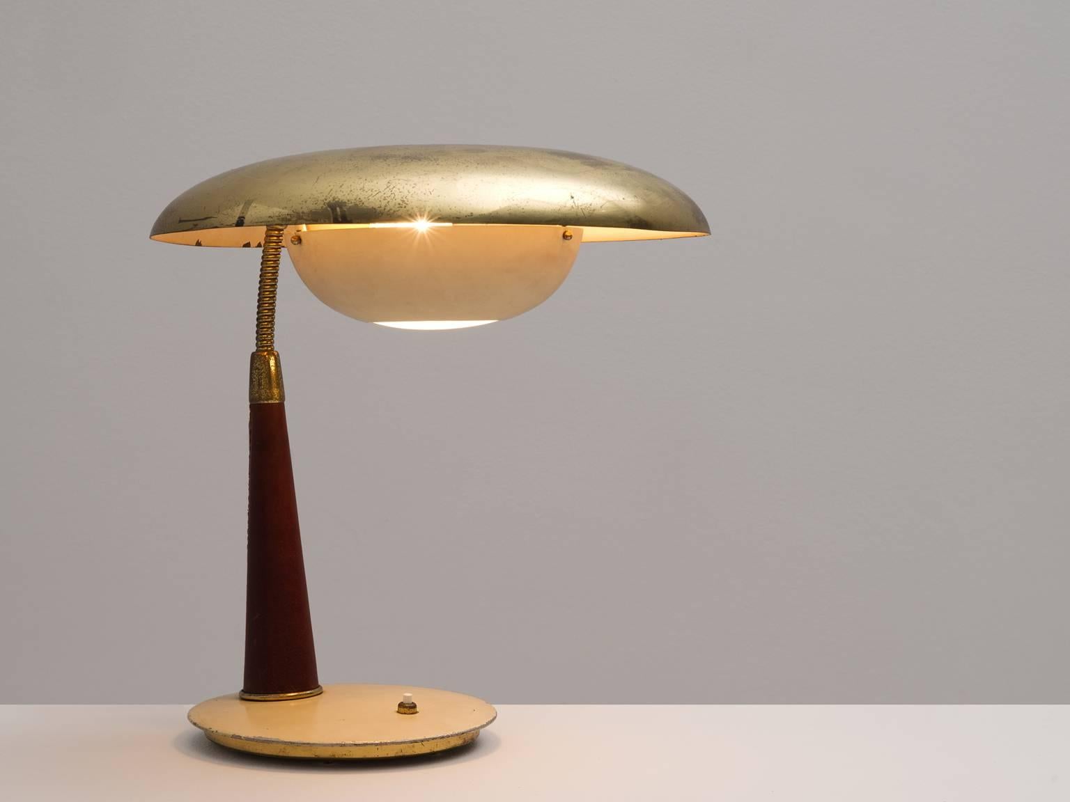 Angelo Lelli for Arredoluce,  table lamp, in brass, metal and leather, by Italy, 1950s. 

Stylish desk light with admirable patinated brass shade, designed by Italian designer Angelo Lelli. The disc-shaped shade has an opposite shade as diffuser.