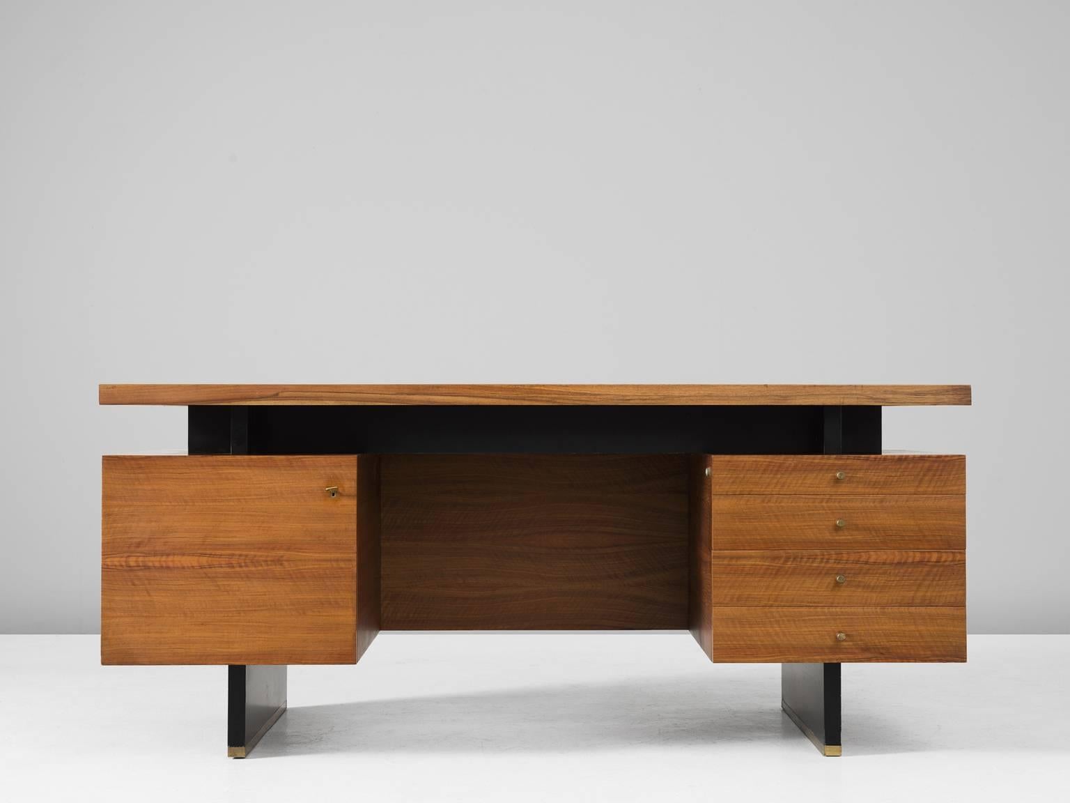Desk, in walnut, brass and oak, by Jos de Mey for Van den Berghe-Pouvers, Belgium, circa 1958.

Rare desk by Belgian designer Jos de Mey. This desk has a great symmetrical and architectural expression. The base consist of two parallel black legs