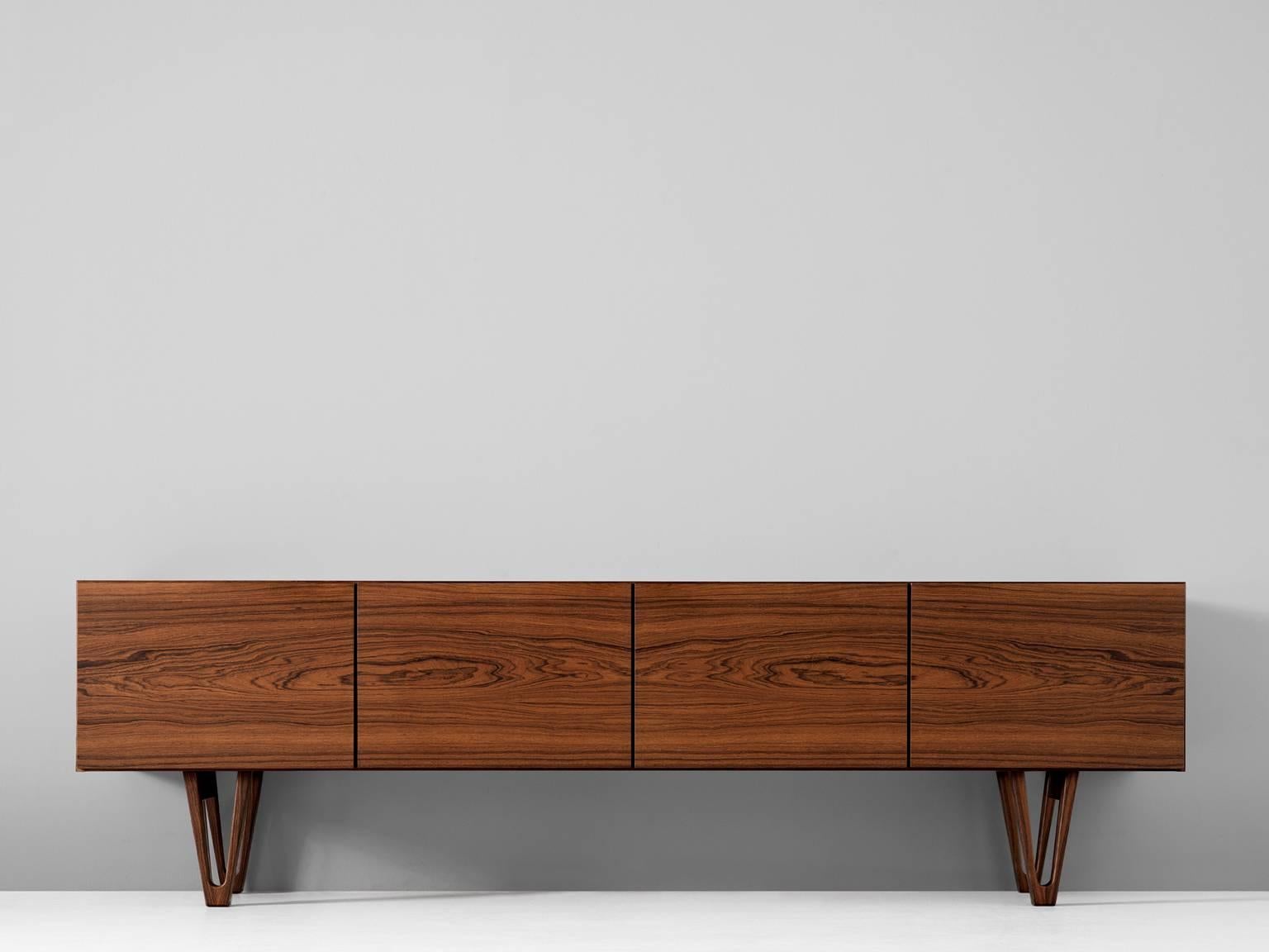 Sideboard in rosewood by Ib Kofod-Larsen for Säffle Möbelfabrik, Sweden, 1958.

Rare rosewood sideboard designed by de Danish designer Ib Kofod-Larsen. This low credenza was produced by the Swedish manufacturer Säffle Möbelfabrik. This model