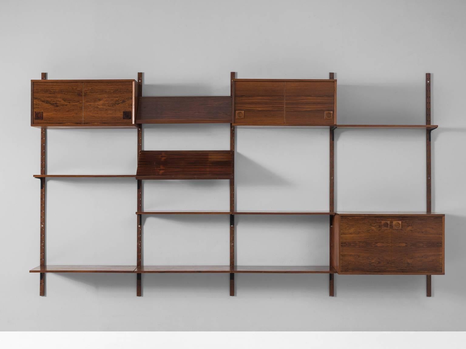 Wall unit, in rosewood and metal, by Albert Hansen, Denmark, 1950s. 

Rosewood shelves and cabinets system by Danish designer Albert Hansen. This cabinet consist of four compartments, which can be arranged to your own wishes. Interesting part are