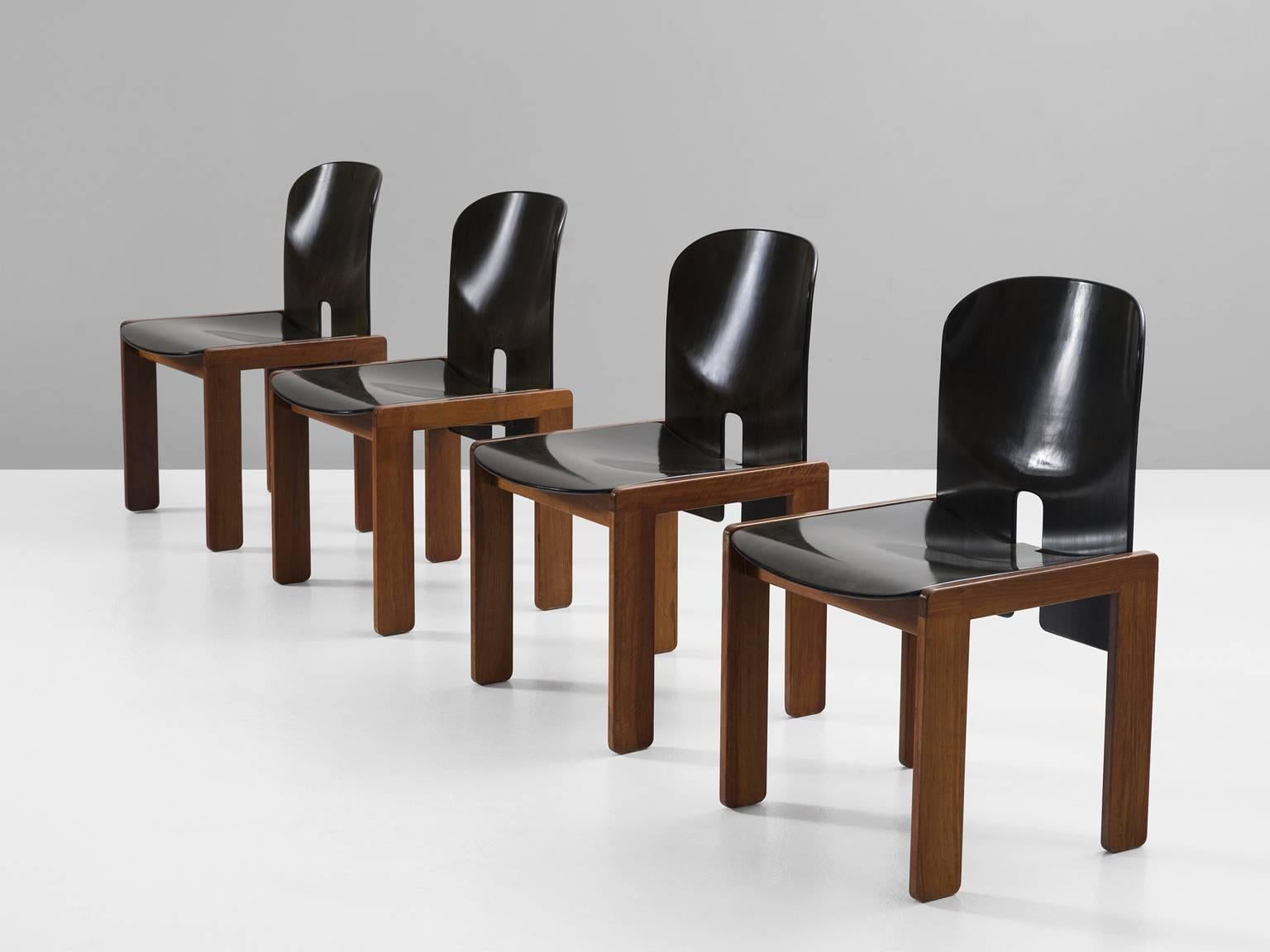 Set of four dining chairs model 121, in walnut and beech, by Afra & Tobia Scarpa for Cassina, Italy 1965.
 
Set of four dining chairs by Italian designer couple Tobia and Afra Scarpa. These chairs have a quite cubic appearance. The base consist of