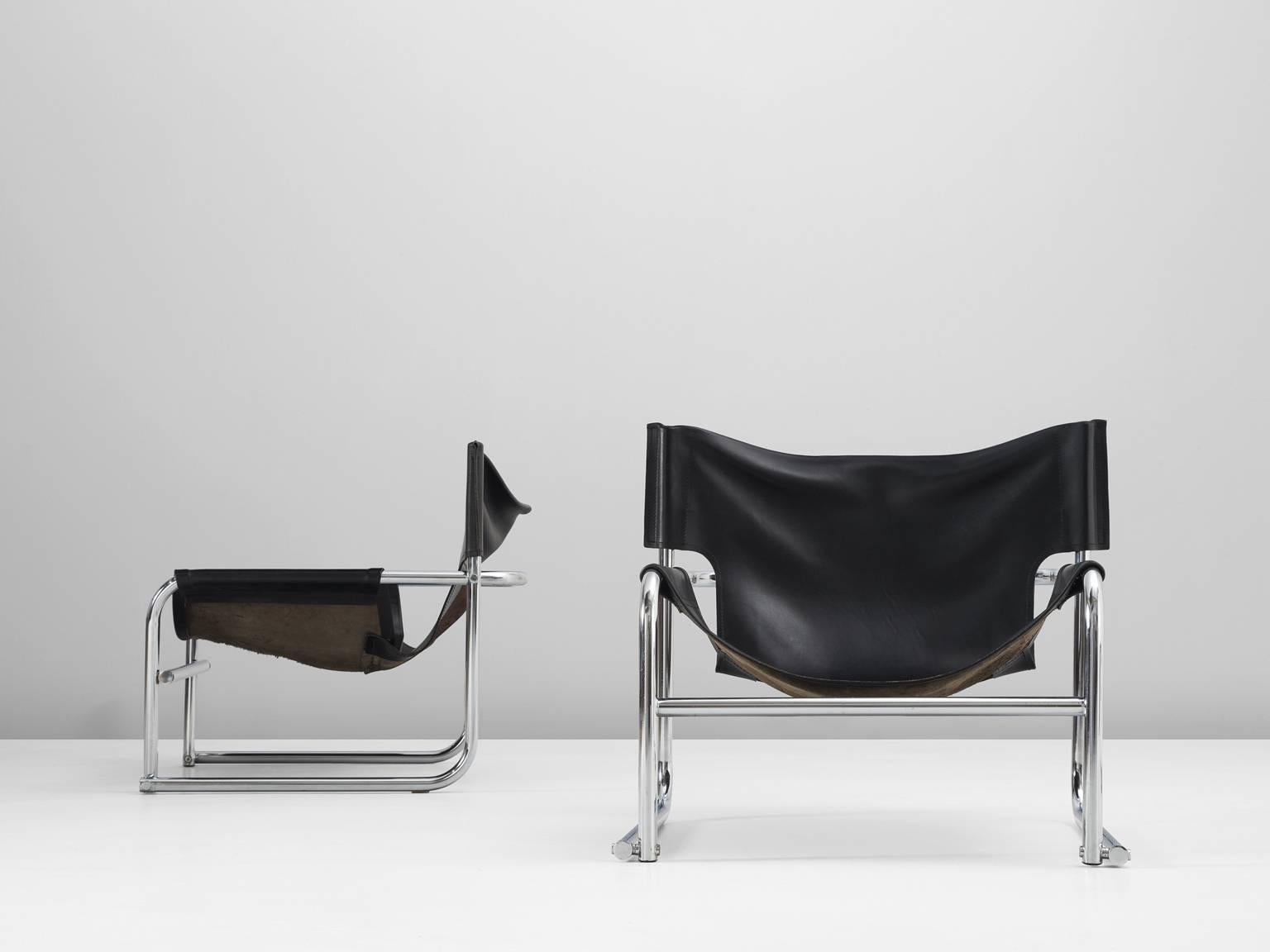 Set of two lounge chairs model T1, in steel and leather, by Rodney Kinsman, United Kingdom, 1970s. 

Set of two tubular armchairs with black leather upholstery. These chairs have a modern appearance due the combination of materials. The design is