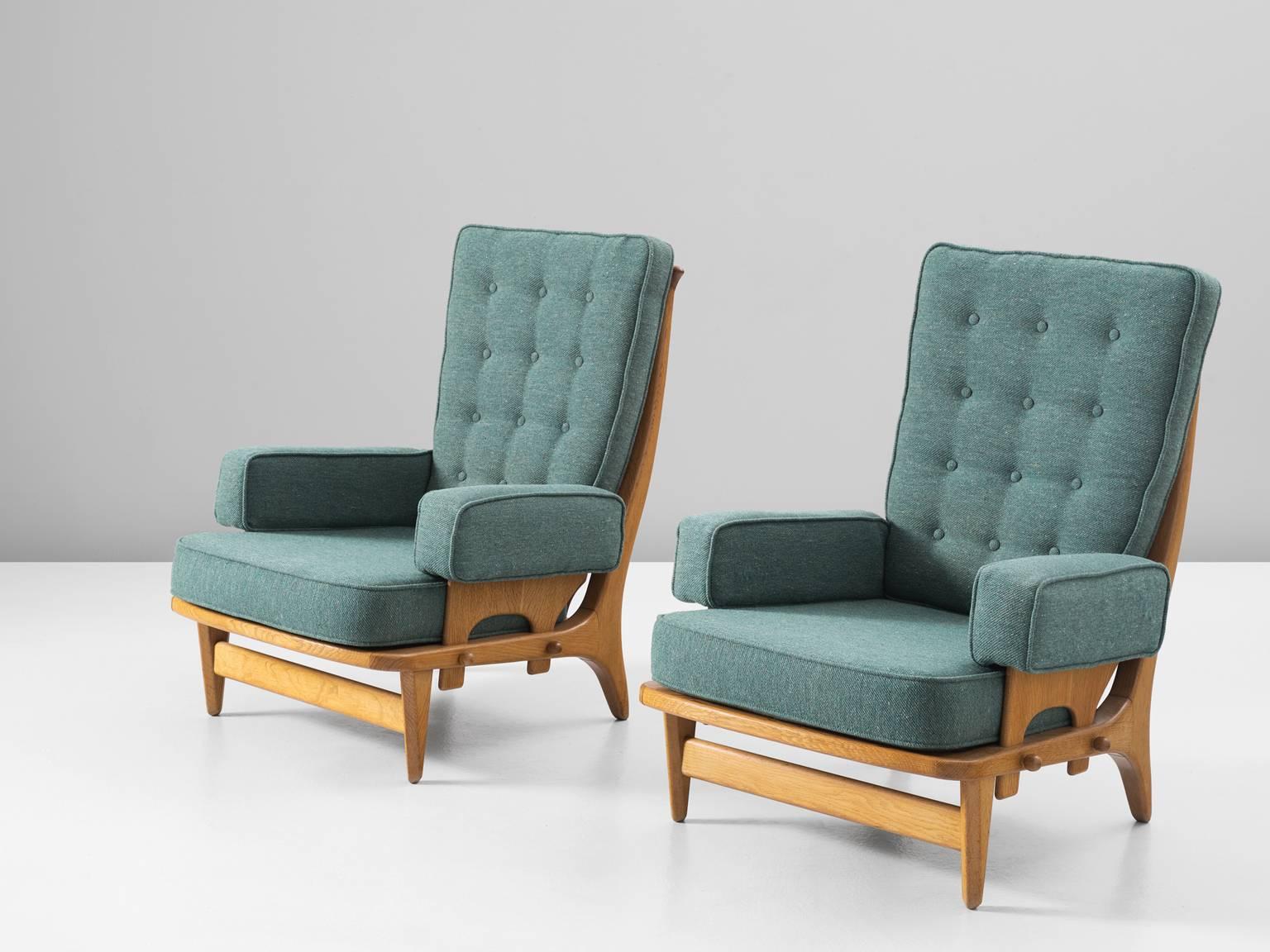 Set of lounge chairs model 'Maxime', in oak and fabric, by Guillerme et Chambron, France, 1965.

A pair of high back lounge chairs in oak and fabric by French designer duo Guillerme and Chambron. These chairs have a beautiful spindle back. The