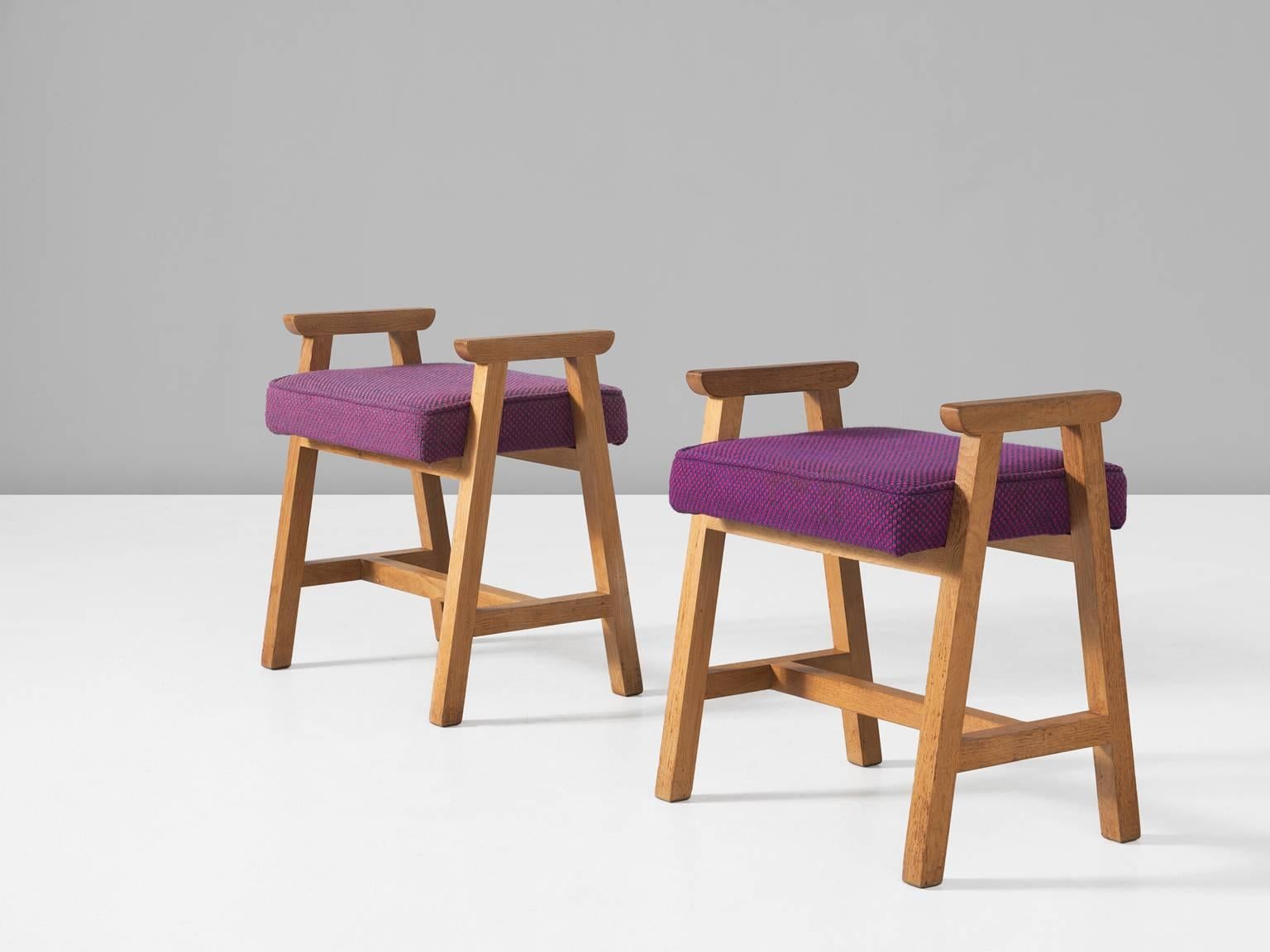 Set of two stools, in oak and fabric, by Guillerme et Chambron, France, 1960s. 

Pair of solid oak wooden stools with colorful purple fabric upholstery. These stools have a nice frame in oak with interesting lines. The base consists of two
