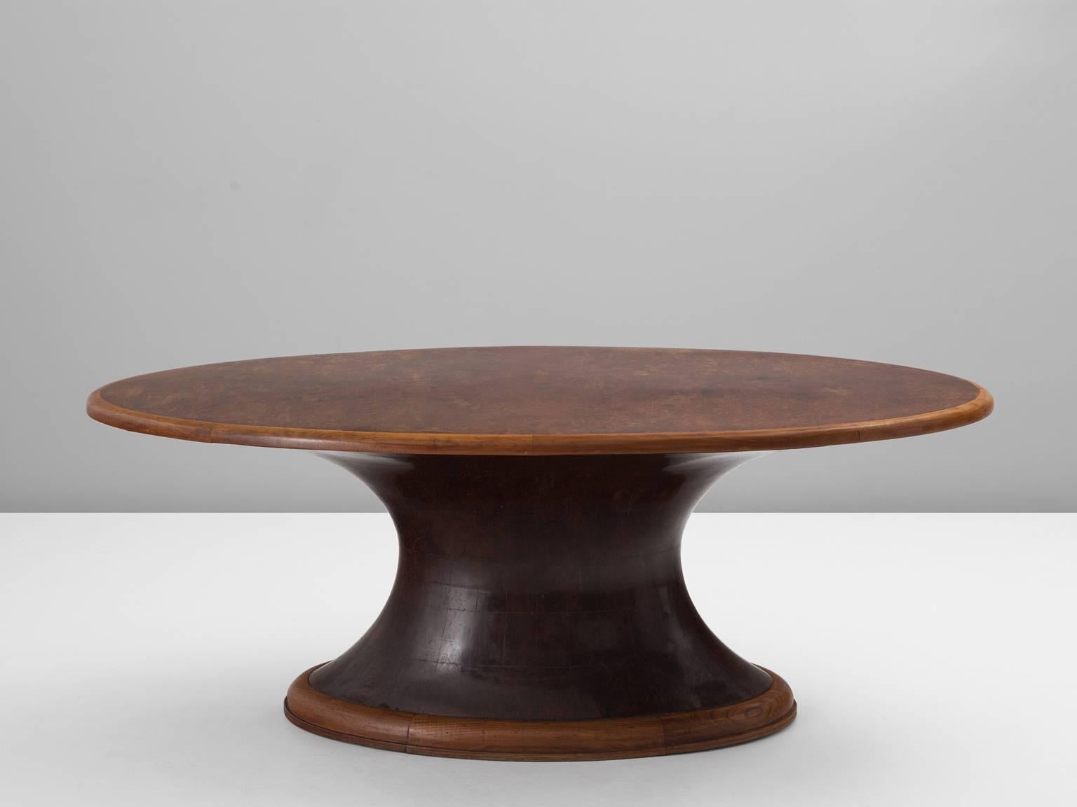 Dining table, in burl and walnut, Italy, 1930s.

Organic shaped pedestal table in burl and walnut. This art-deco table is made with great craftsmanship and time-consuming techniques. The base consists of a wooden frame and is upholstered with wooden