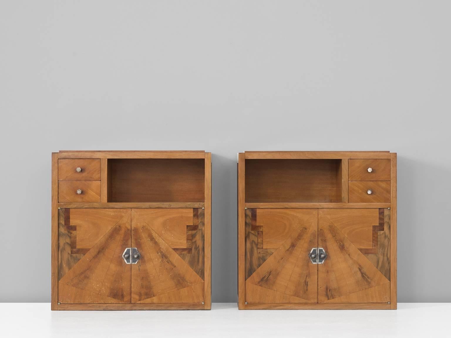 Set of two cabinets, in wood and metal, France 1930s. 

Set of two Art Deco cabinets with decorated front. These nightstands have a beautiful decorated front, with an illustration in different types of wood. Great craftsmanship is visible. The