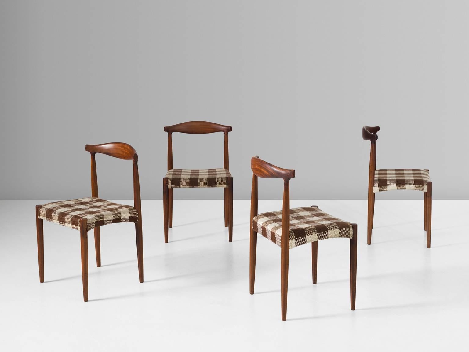 Set of four dining chairs, in rosewood and fabric, for Vamo Sonderberg, Denmark 1950s. 

Set of four dining room chairs in rosewood and fabric upholstery. The four cylindrical legs are tapered and therefore very elegant. The back is beautifully